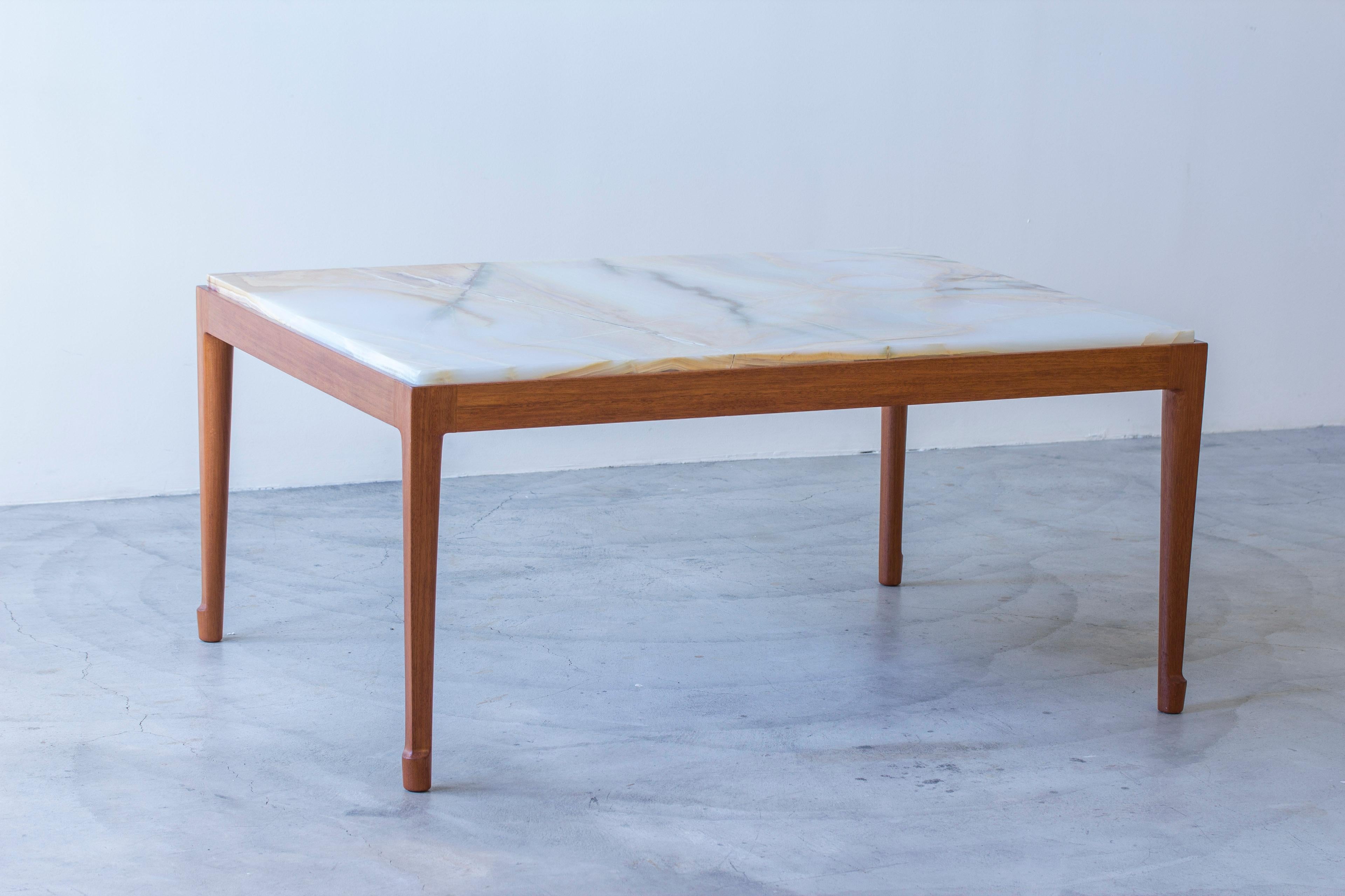 Sofa table by unknown designer and maker, Similar to the style of Josef Frank and Firma Svenskt Tenn. Solid mahogany base with sculpted tapered legs with beautifully shaped 