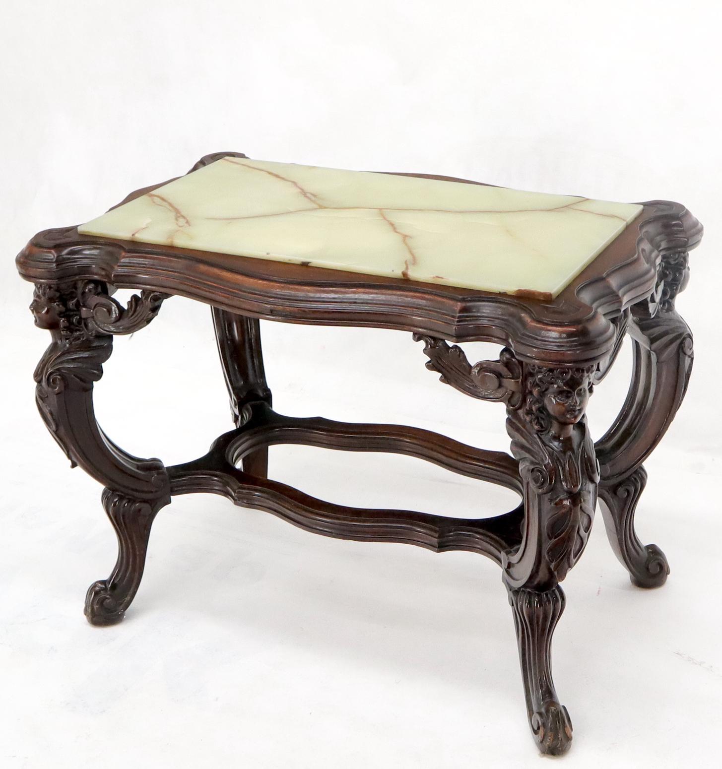 Fine detail carved walnut cherubs base onyx top side occasional table.