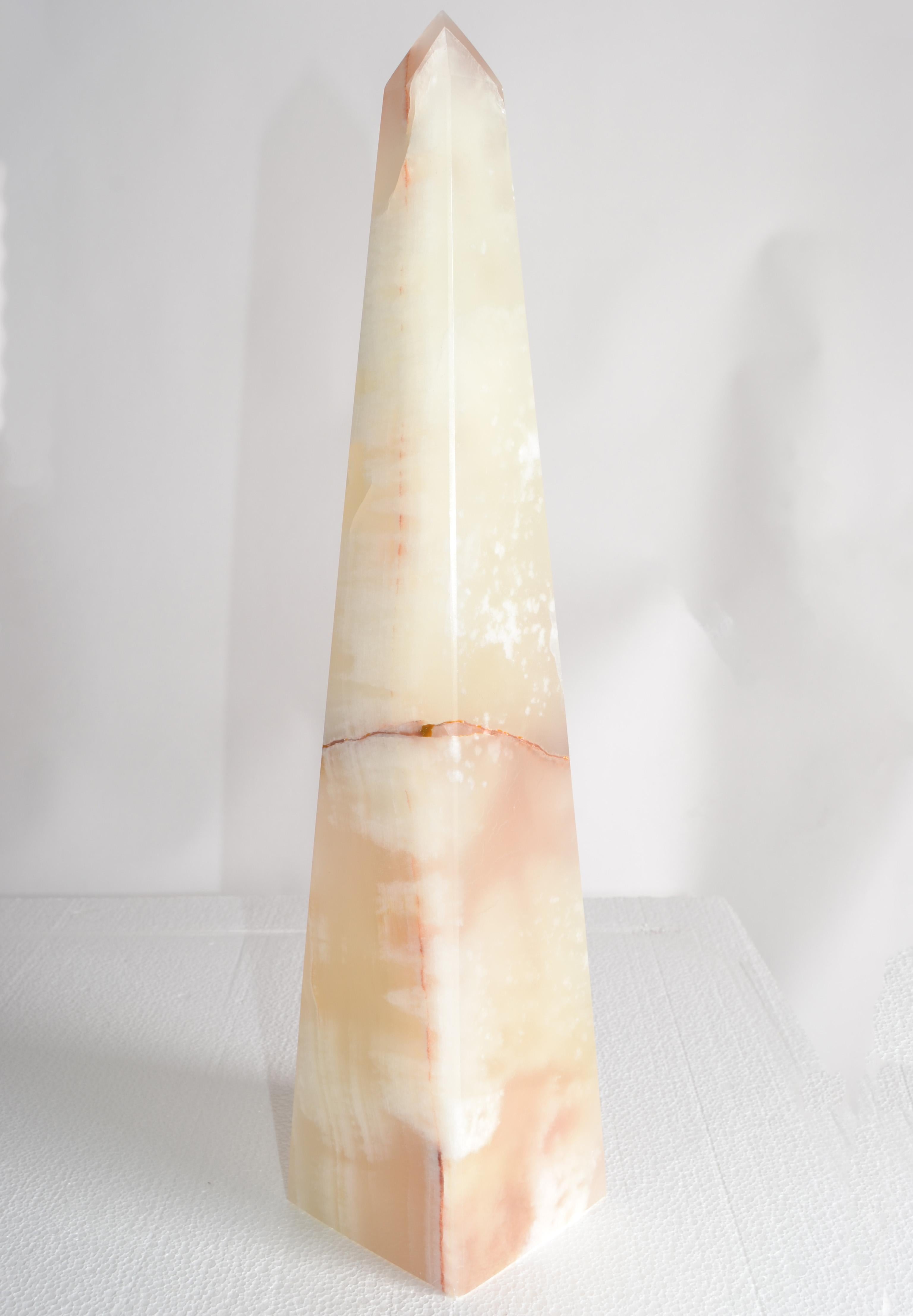 This is a tall vibrant Onyx Obelisks or Bookend with natural details and sleek splendor lines. Attributed to Raymor and made in Italy circa late 1970s.
Note the natural banded patterns of this Obelisks.
Add a geometric Onyx Stone Obelisk to your
