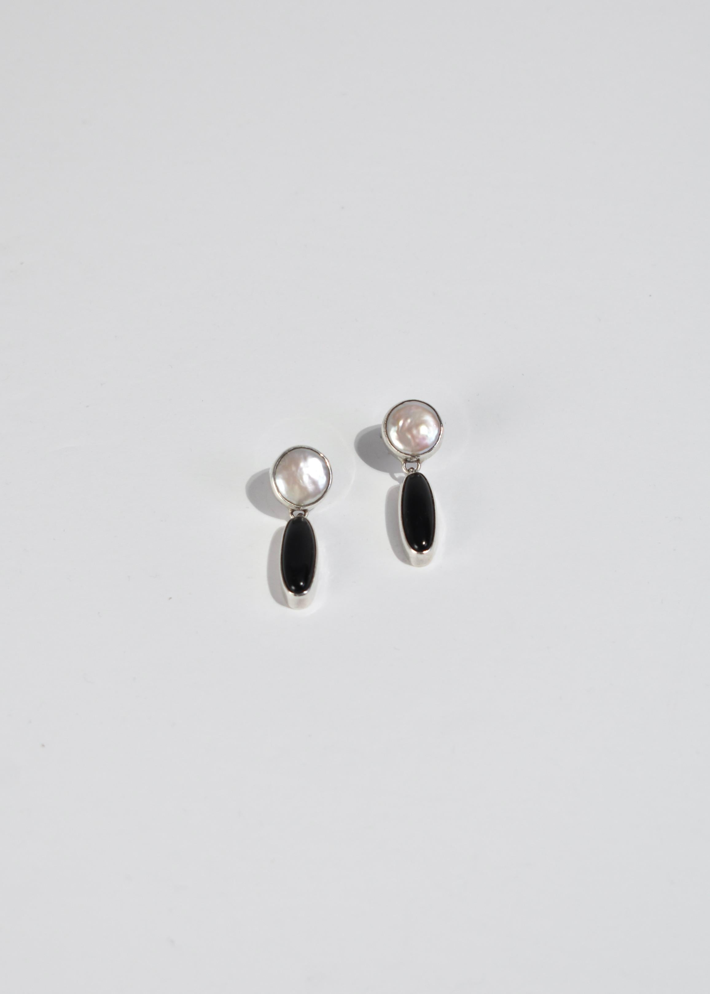 Vintage sterling earrings with freshwater pearl and onyx drop detail, pierced. Stamped 925.
