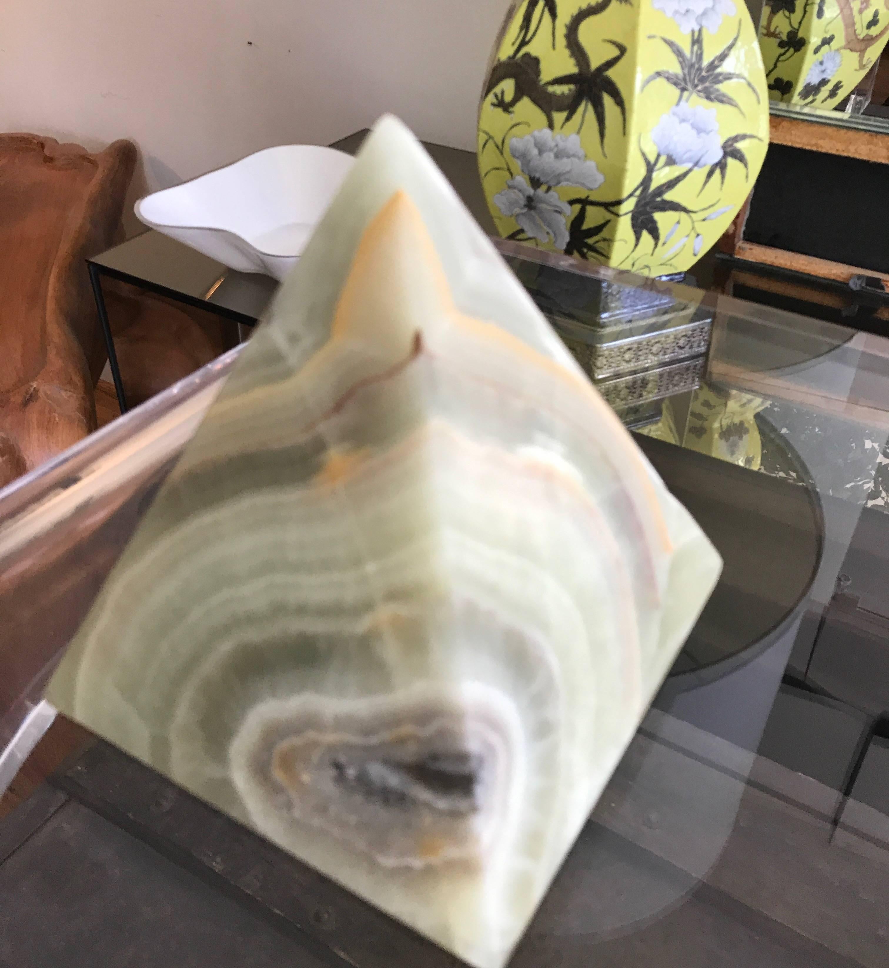 A large Mid-Century Modern sculptural Mexican onyx decorative tabletop pyramid.
Great desk top accessory.