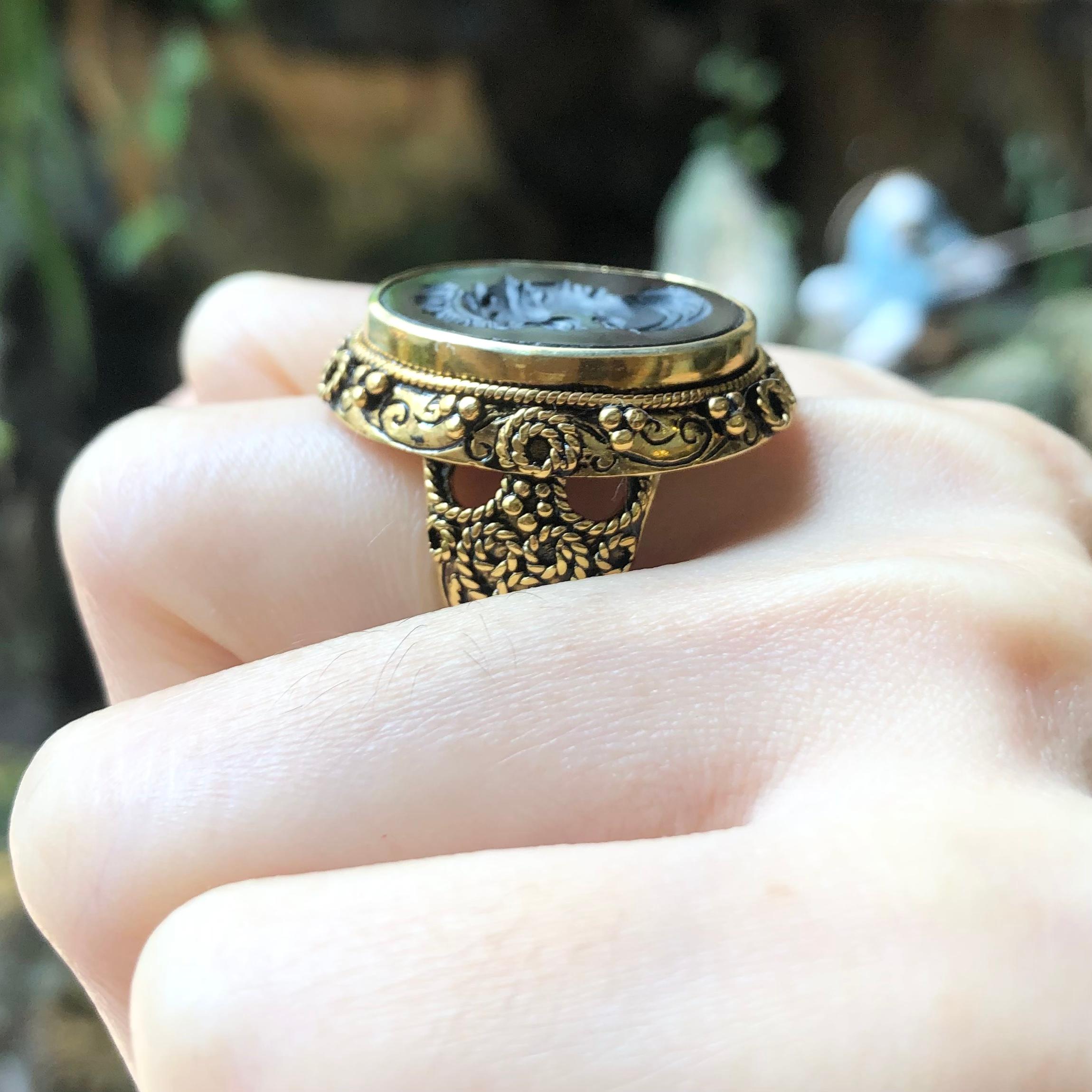 Onyx Ring  set in Silver Settings

Width:  2.1 cm 
Length: 2.8 cm
Ring Size: 58
Total Weight: 16.67 grams

*Please note that the silver setting is plated with gold to promote shine and help prevent oxidation.  However, with the nature of silver,
