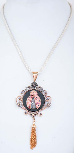 Onyx, Rubies, Sapphires, Diamonds, 14 Karat  Gold and Silver Pendant Necklace.
