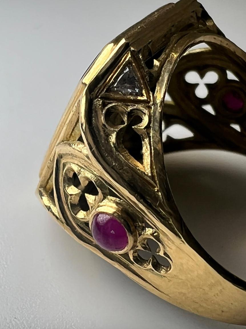 A stunning black Onyx Signet Ring, adorned with rubies and diamonds on 18k gold, a true masterpiece. 