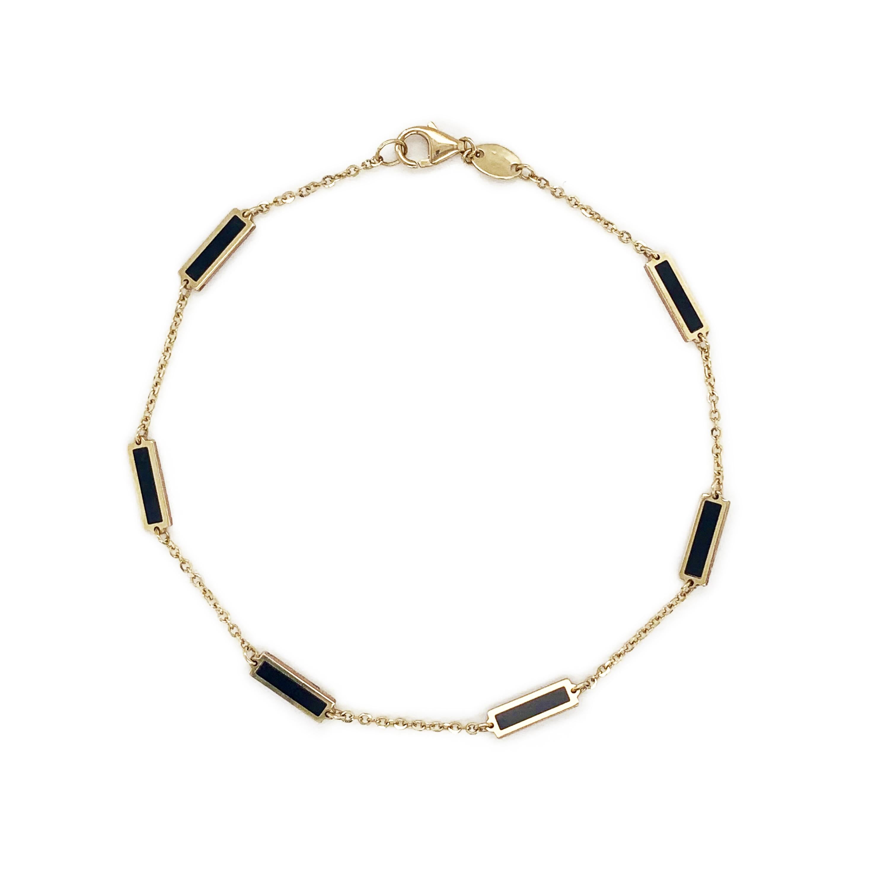 Quality Onyx Bar Bracelet: Focused on design and detail, these beautiful Onyx gemstone bracelet of your choice features a station bar design and is crafted of 14k yellow gold. Bracelet measurement is 7