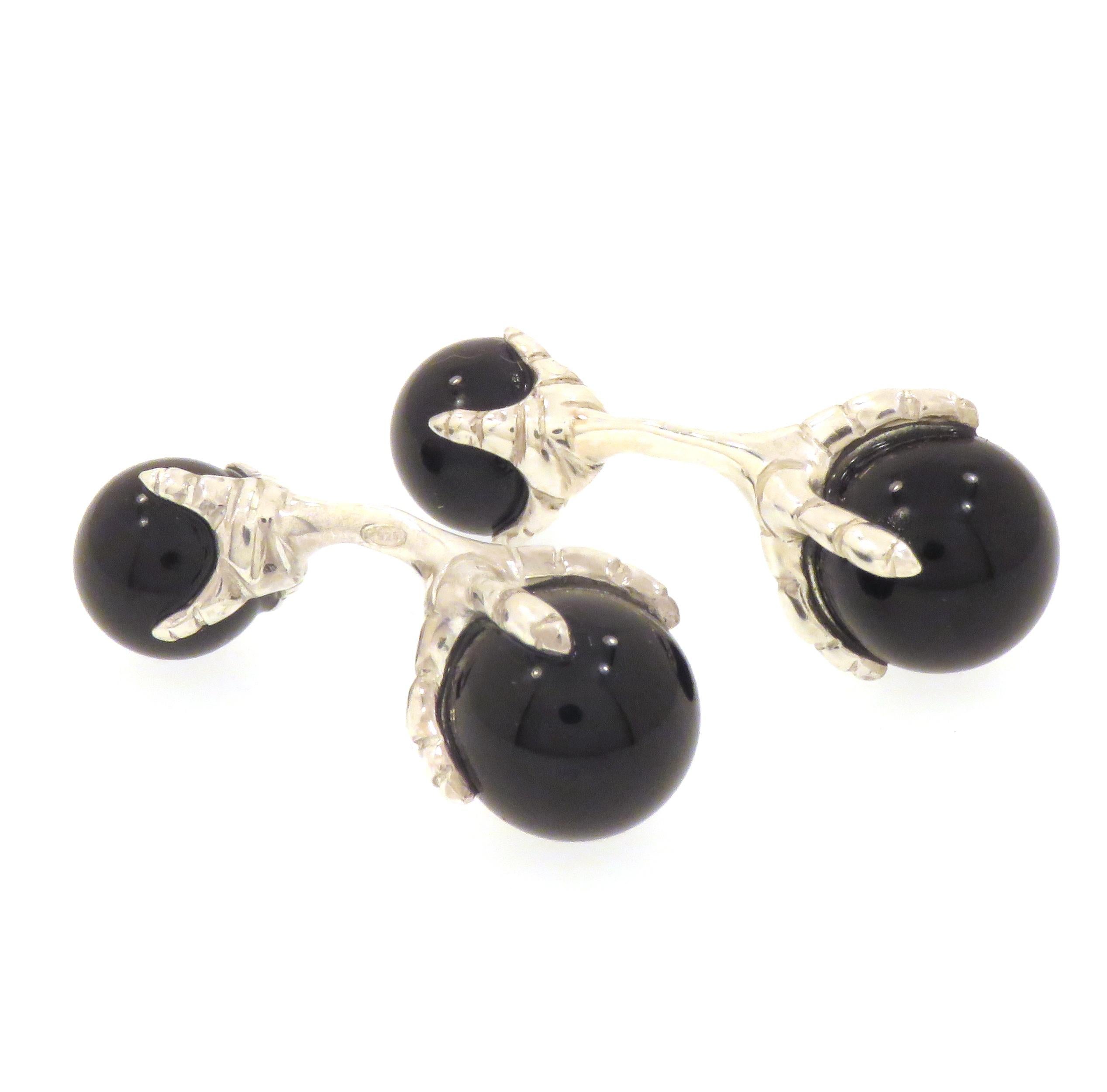 Beautiful cufflinks crafted insterling silver featuring eagle talons grabbing onyx beads. The size of the bigger beads is 12 millimeters / 0.472 inches and of the smaller ones is 10 millimeters / 0.393 inches.  These cufflinks are handcrafted in