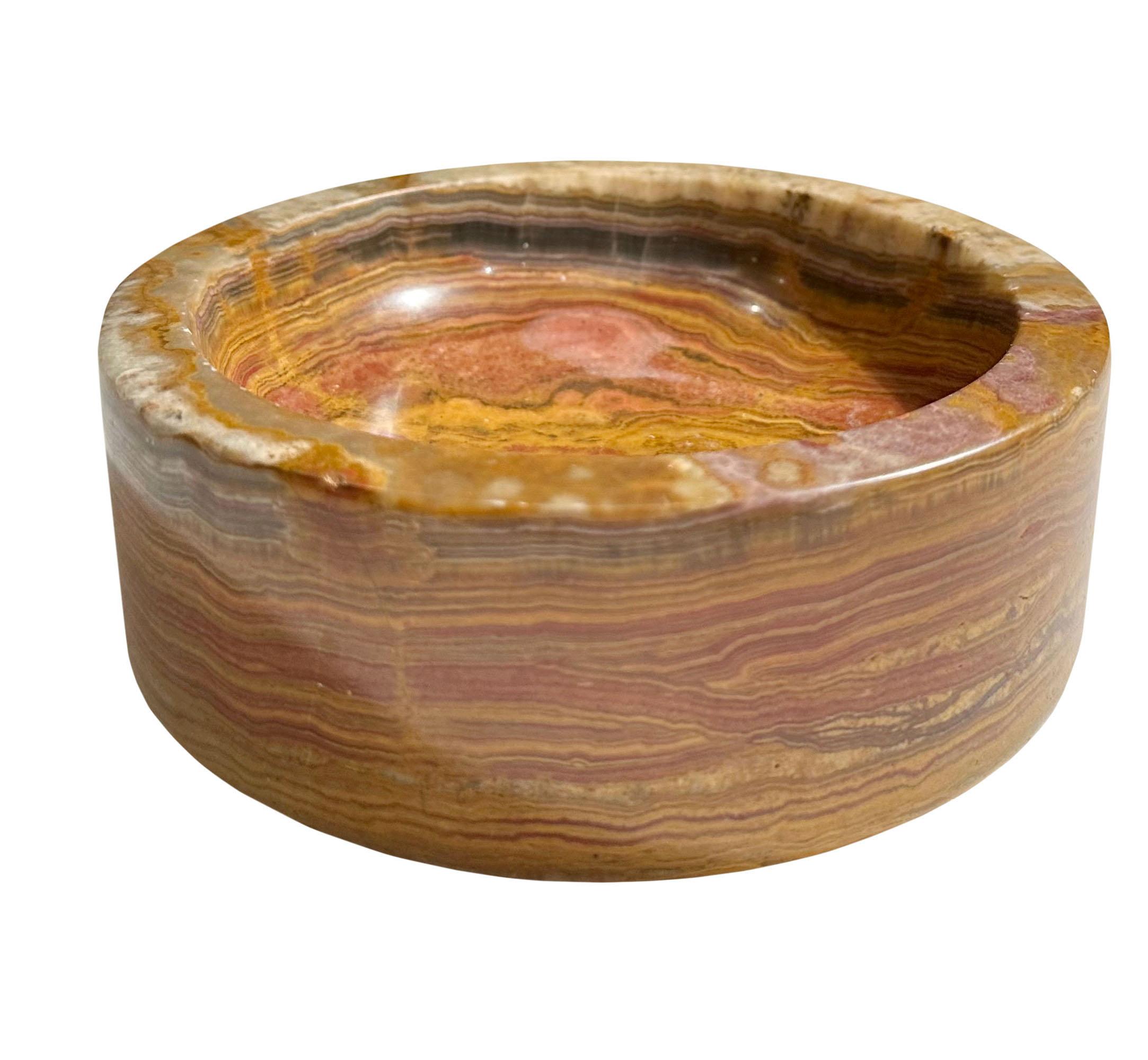 A small but heavy reddish brown amber swirl bowl made of Onyx. Italy, circa 1950s.
