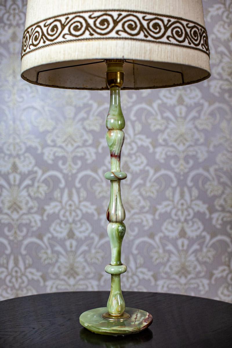 We present you a table lamp with a linen lampshade.
The whole is made of green onyx.
This item is from the 1950s-1960s.

There is a socket for a single E27 light bulb.
The power source is 230 V.

Presented lamp is in very good condition.
The