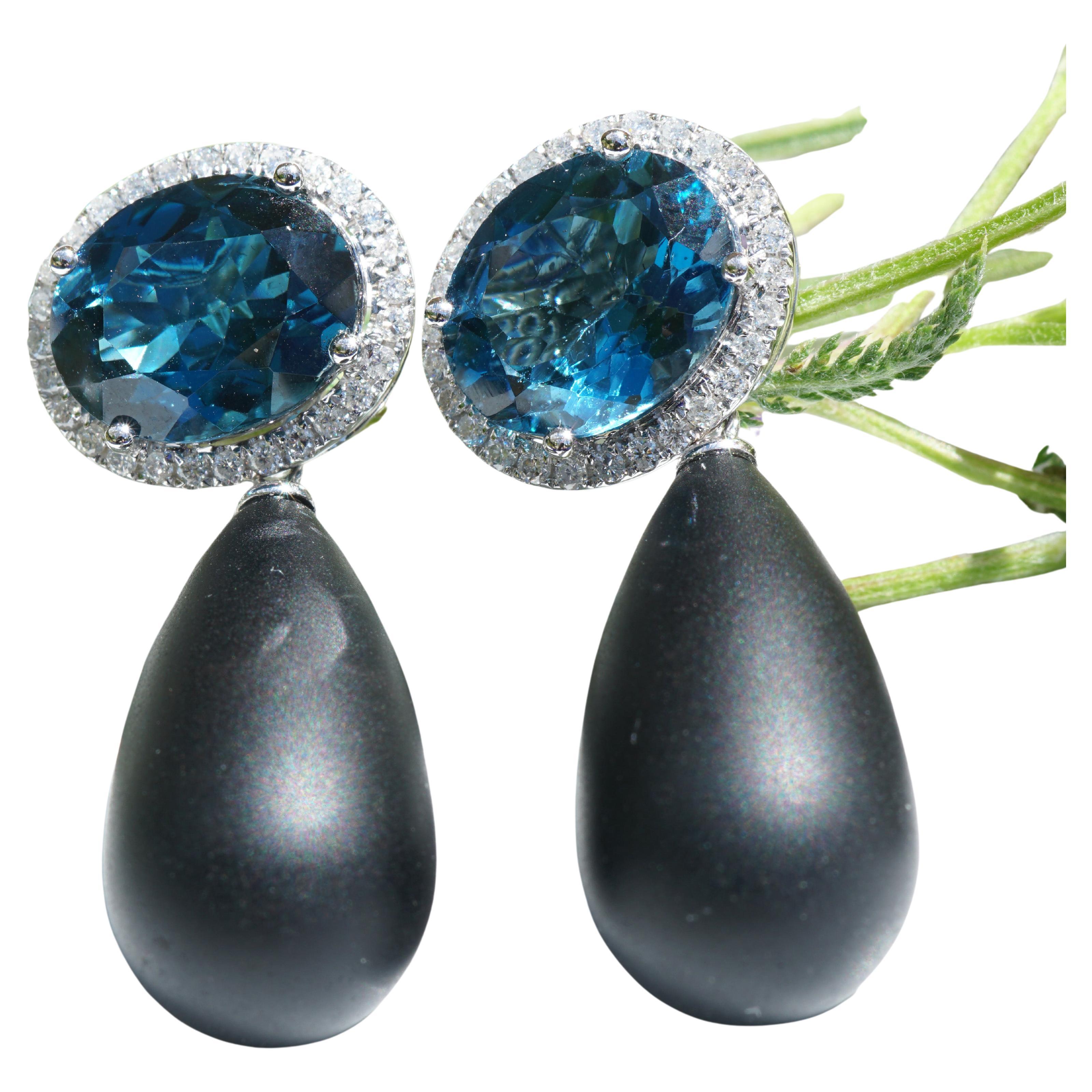 Drama Queen, very special opulent earrings, earrings with unusual gemstones, here onyx drops and two blue topazes in the color Londen Blue (treated) total approx. 10.62 ct, full cut brilliants total approx. 0.52 ct, W (white) / SI-P (small-distinct