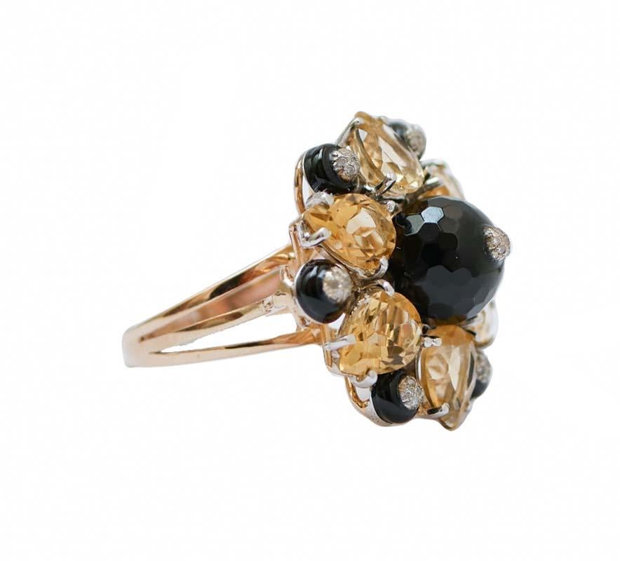 Amazing ring in 14 kt rose gold and silver structure mounted with a sphere of onyx in the central part with diamonds surrounded by other small onyx with diamonds alternated with drop topaz.
This ring was totally handmade by Italian master goldsmiths