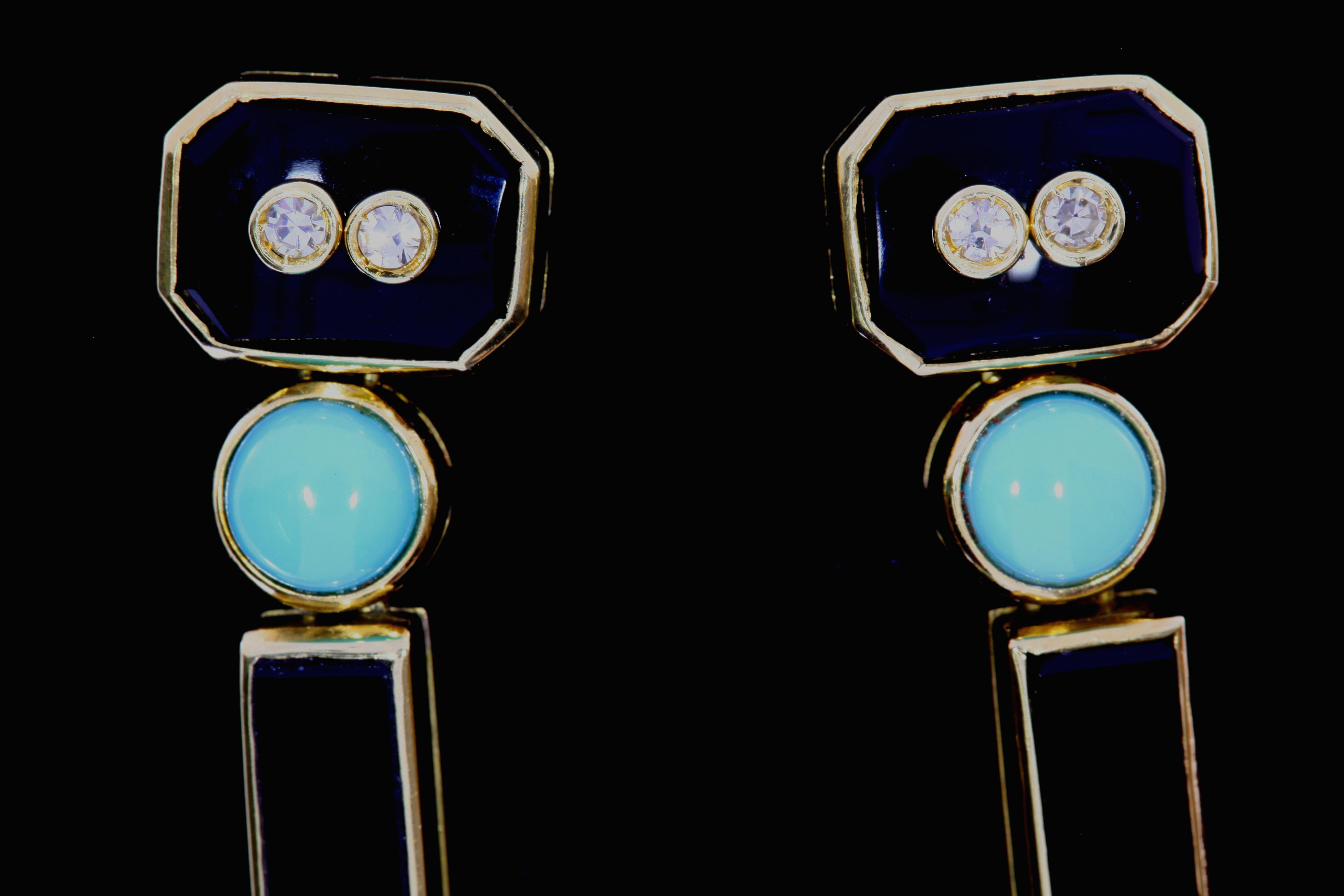 These earrings from the 1930's in the Art Deco style have turqoise, onyx, diamonds, set in 18 karat yellow gold. The earrings dangle from side to side and are secured with a pushpin. 