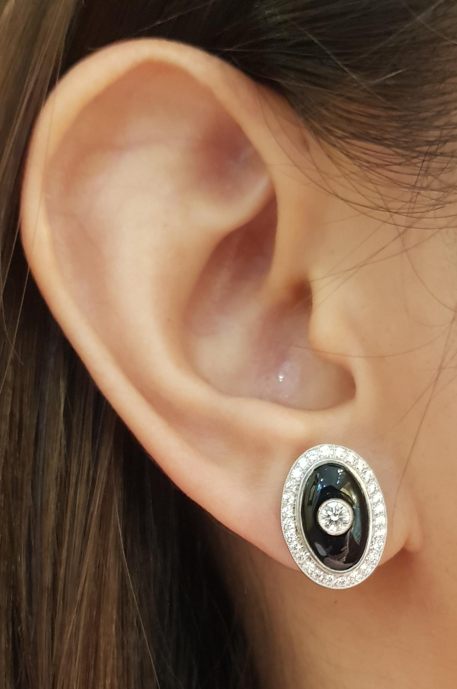 Onyx with Diamond 0.71 carats Earrings set in 18 Karat White Gold Settings

Width:   1.20 cm 
Length:  1.70 cm
Total Weight: 7.61 grams


