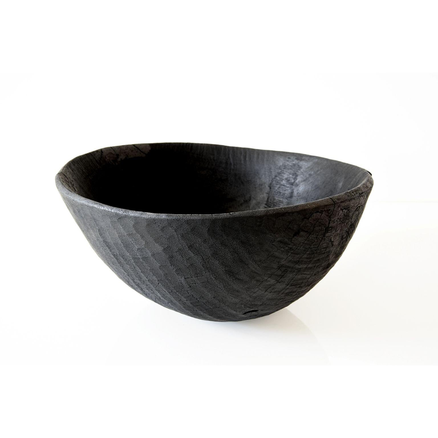 OO.03 Bowl vase by Sebastien Krier + Bois Brulé
Dimensions: D30 x H15 cm
Materials: Wood

All these pieces are unique, they are mottled, modified, refined and
burnt according to the Japanese technique SHOU-SUGI-BAN. With treatment in surface to