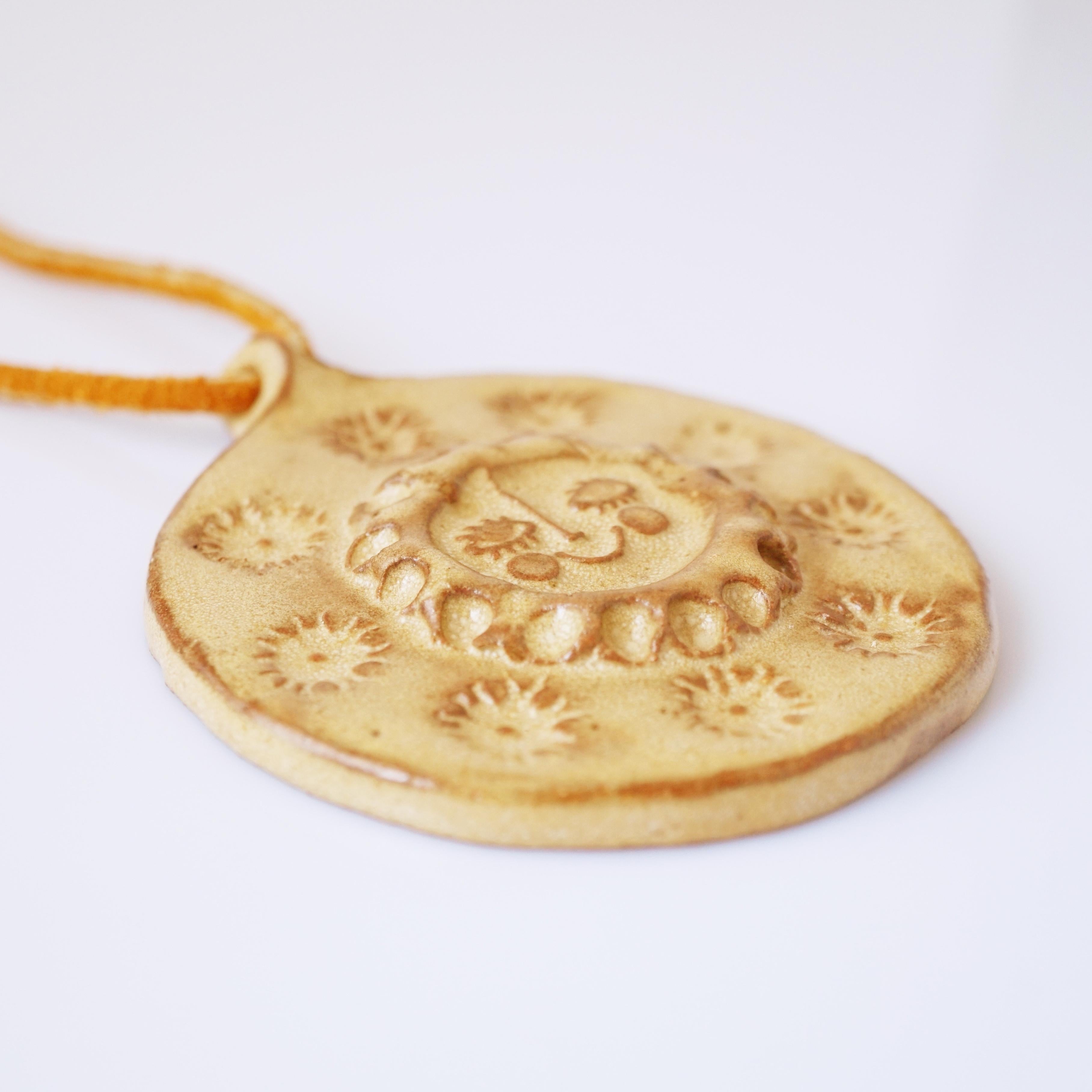 OOAK Smiling Sun Glazed Ceramic Medallion Necklace With Leather Cord, 1960s In Good Condition For Sale In McKinney, TX