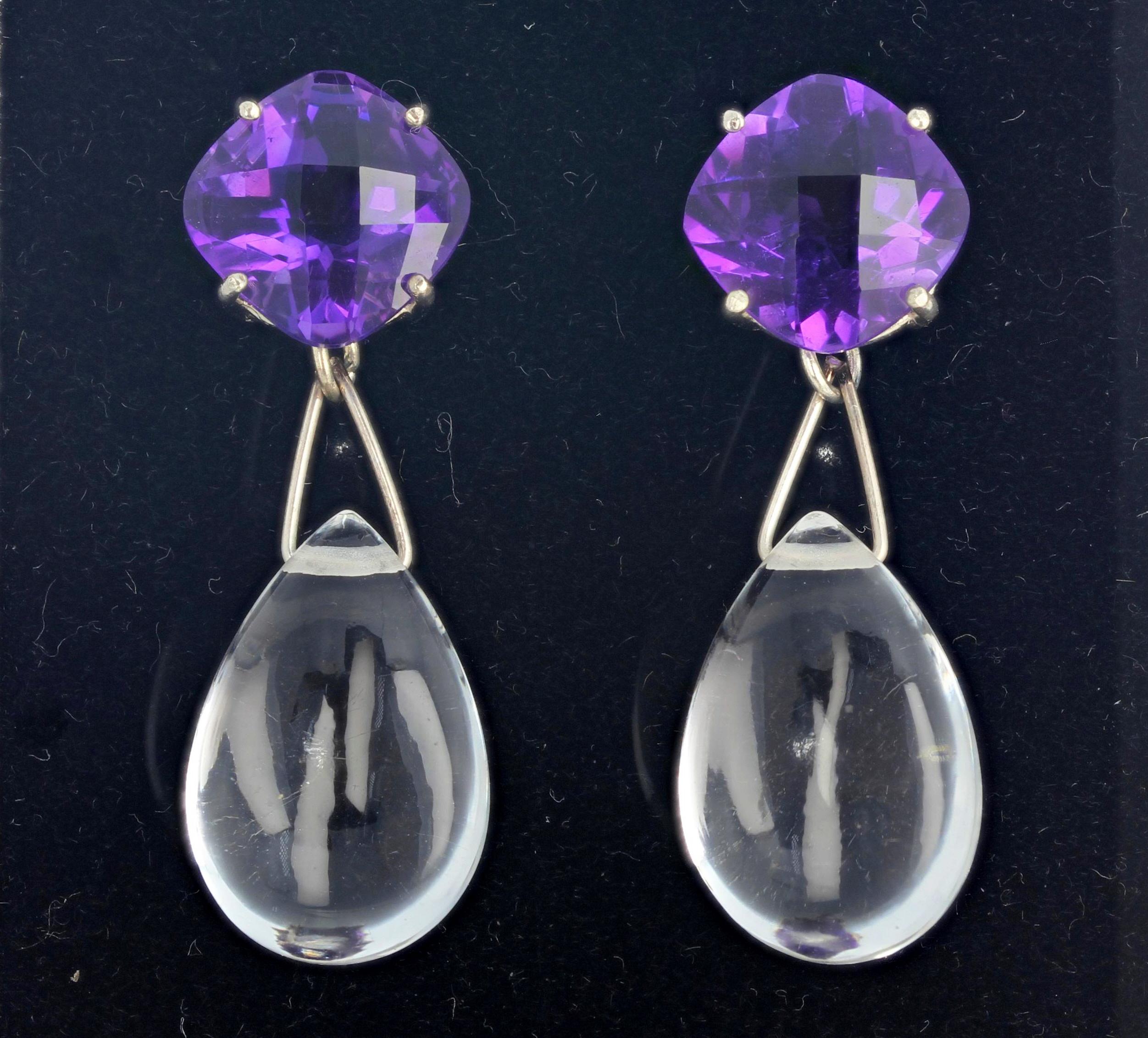 Brilliant glittering checkerboard gem cut matching Amethysts - total of 9.94 carats - set with dangling glowing transparent matching silver quartz - 33.4 carats hanging approximately a total of 1 1/2 inches long - set in sterling silver very elegant