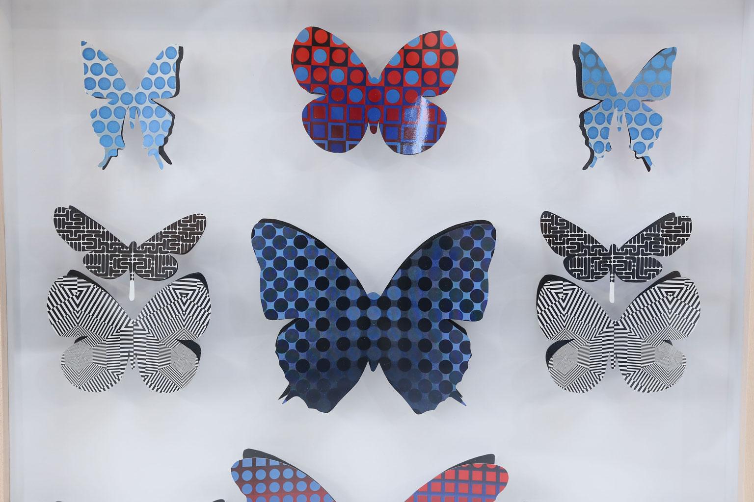 Op art butterfly box: vintage (circa 1960-1979) Op art handcut into butterfly shapes and pinned within a shadow box as specimen. Framed in unfinished maple. Two more similar pieces available (ref: LU98471691135 and LU984716911321).