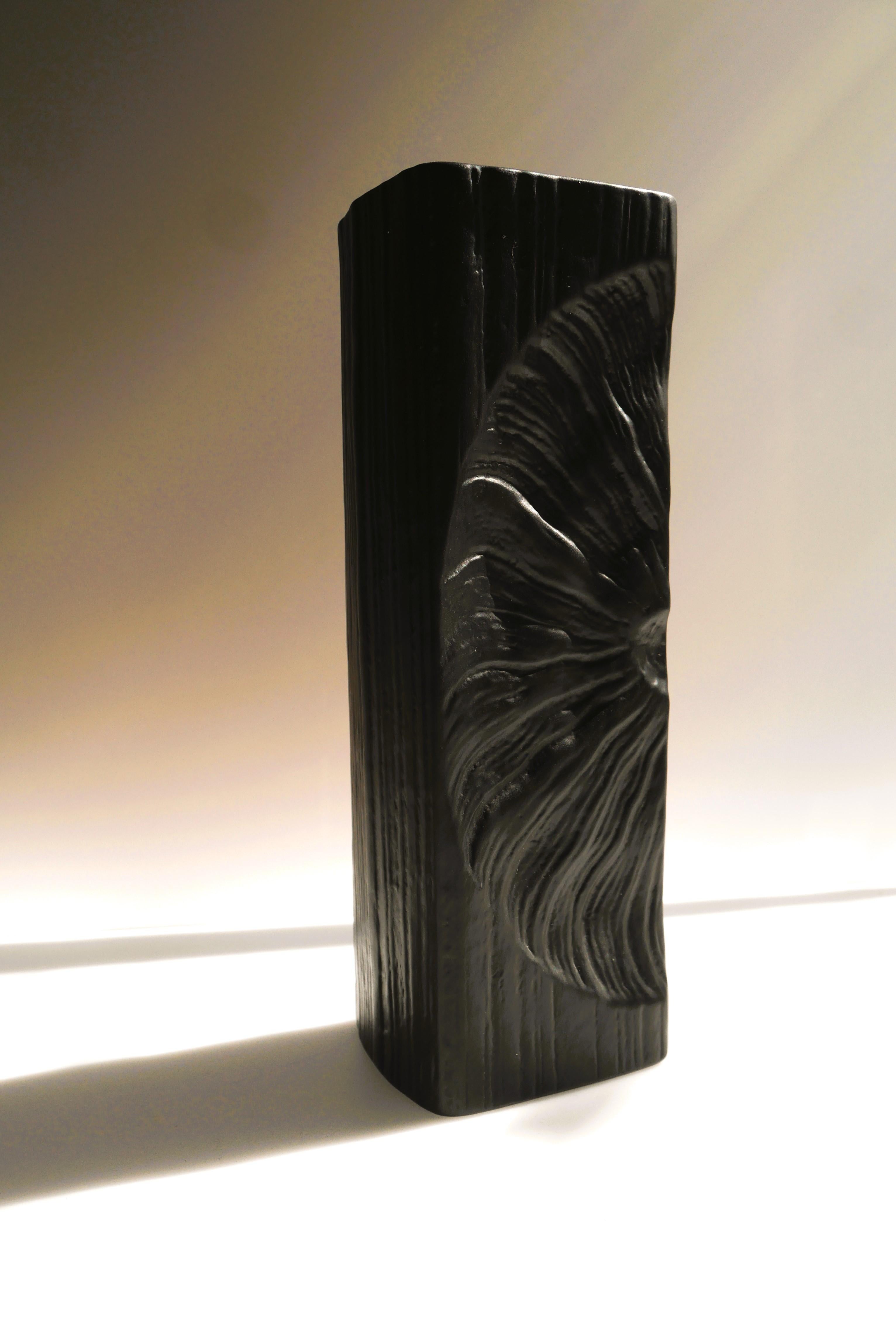 A fantastic Bisque porcelain Op-Art vase from Studio line Rosenthal made by the talented Martin Freyer, Germany. A rather large black ceramic vase with incredible design. The vase is a piece of art. It has imprinted patterns which resemble a fossil.