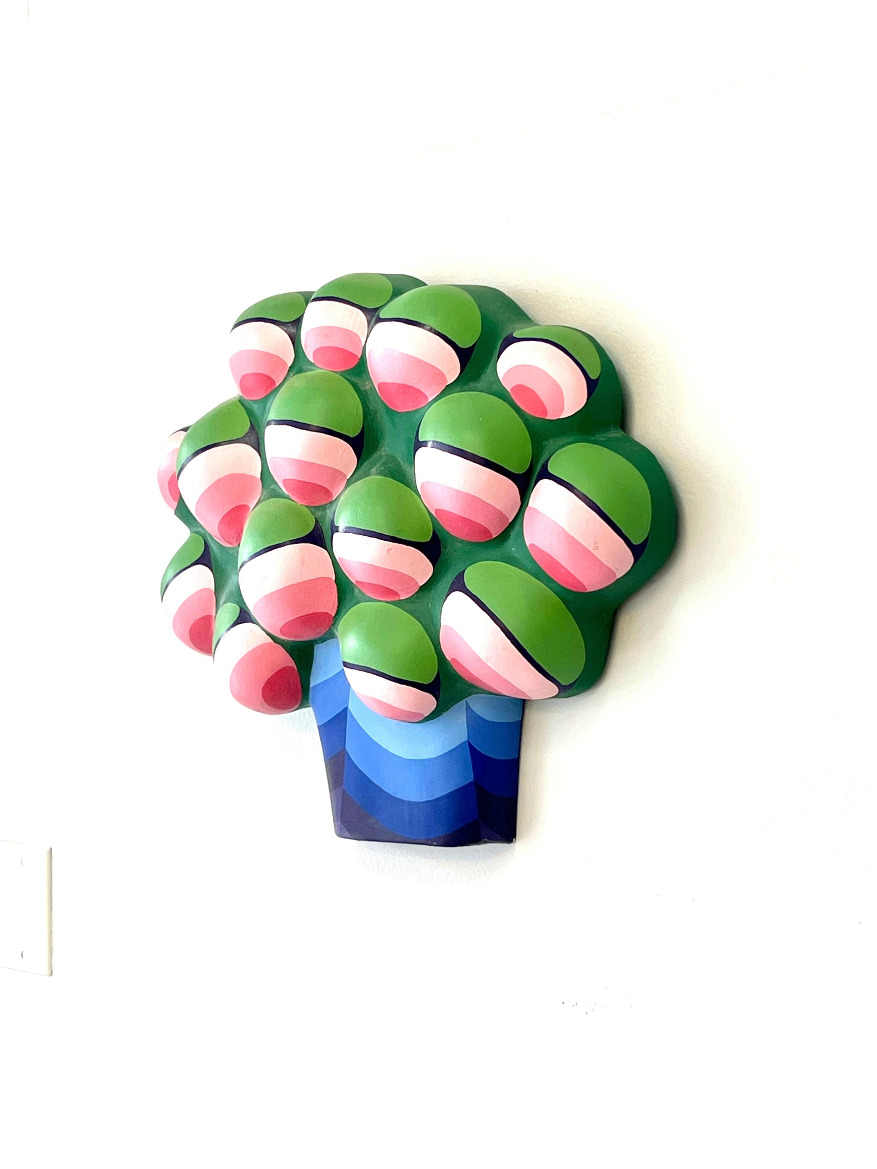A quite unusual wall sculpture. A voluptuous bouquet of flowers rendered in a tridimensional op art style. Its acrylic on papier mache. 


