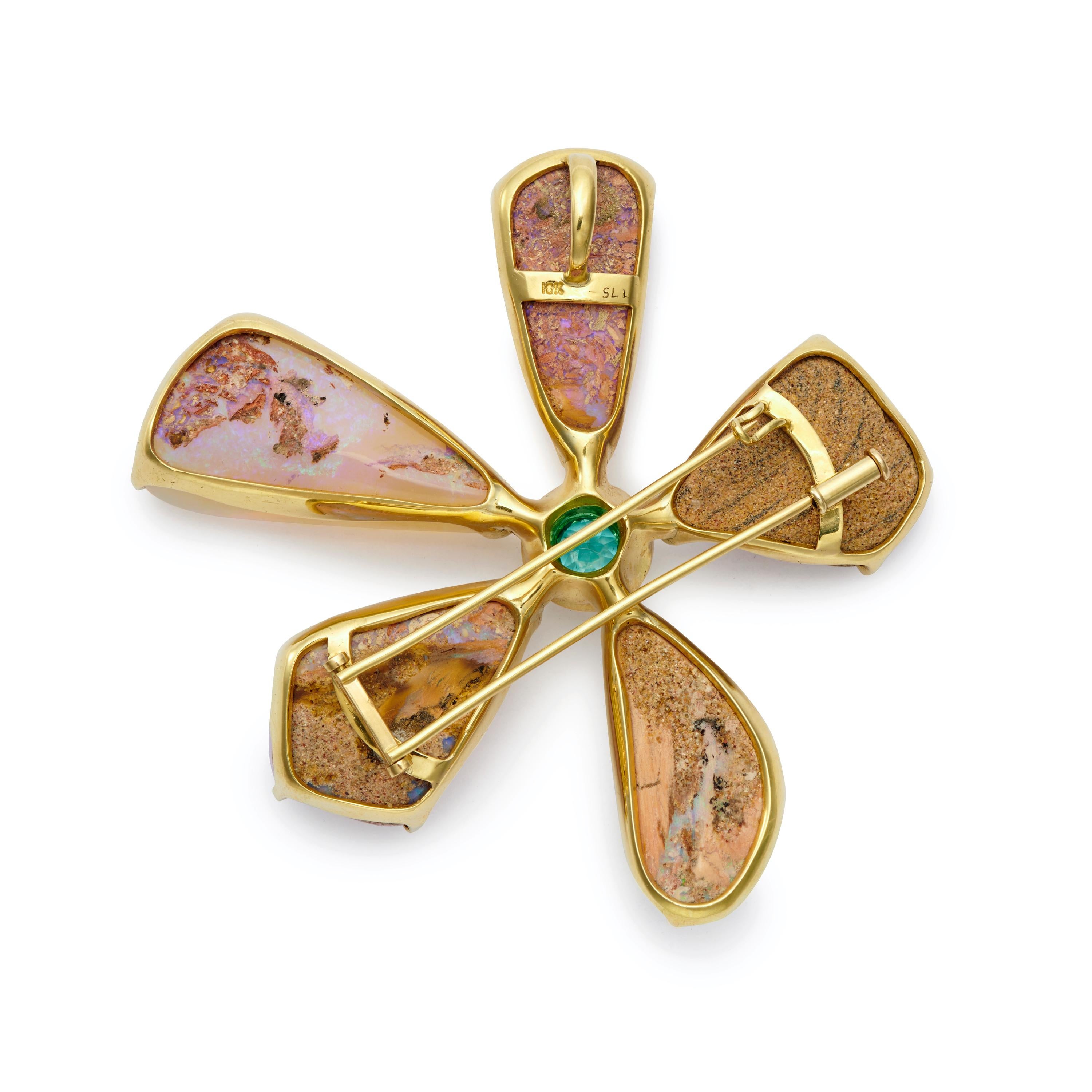 Petals of Opal, with a detailed center of Paraiba Tourmaline (1.13 Carat) and Diamonds, form this spectacular Flower Pin/Pendant. Set in 18 Karat Gold.

Chain not included in the cost of pin/pendant.