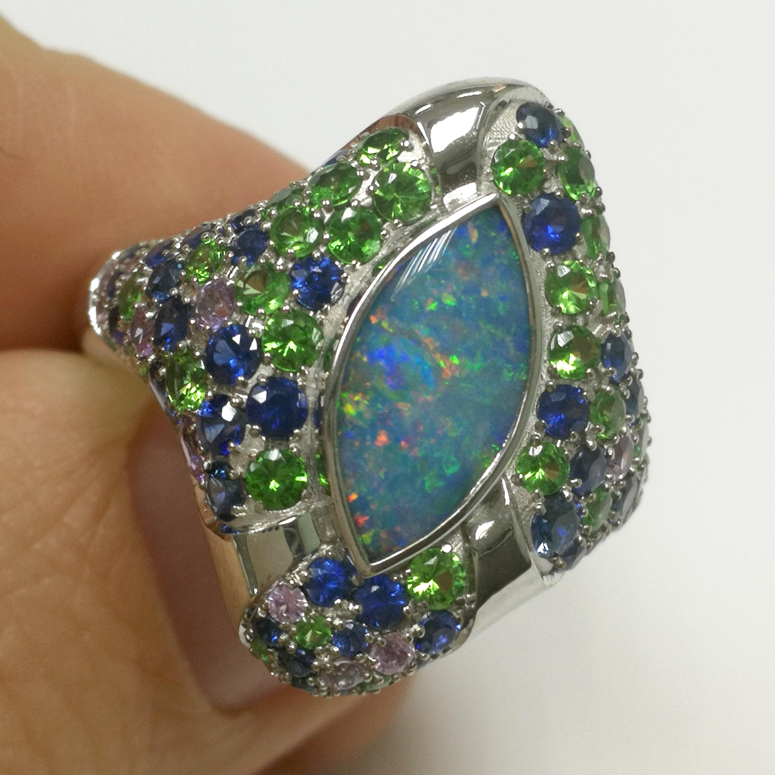 Contemporary Opal 1.42 Carat Blue Purple Sapphires Tsavorite White 18 Karat Gold Riviera Ring For Sale