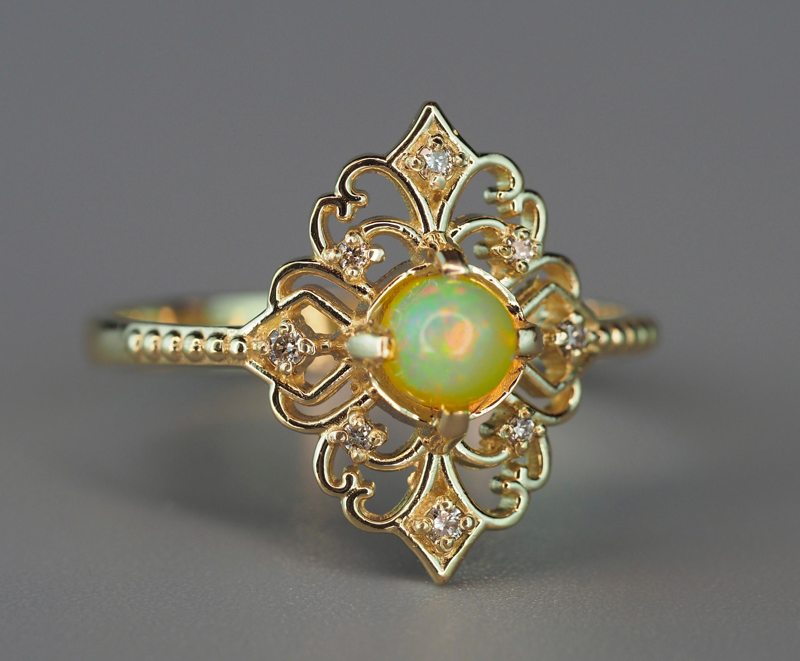 Opal 14k gold Ring. 
Round cabochon opal ring. Genuine opal ring. Vintage style ring with opal. Dainty opal ring. Art-deco opal ring.

Metal: 14k gold
Weight: 1.9 g. depends from size

Set with opal, color - yellow with play of colors
Round cut,