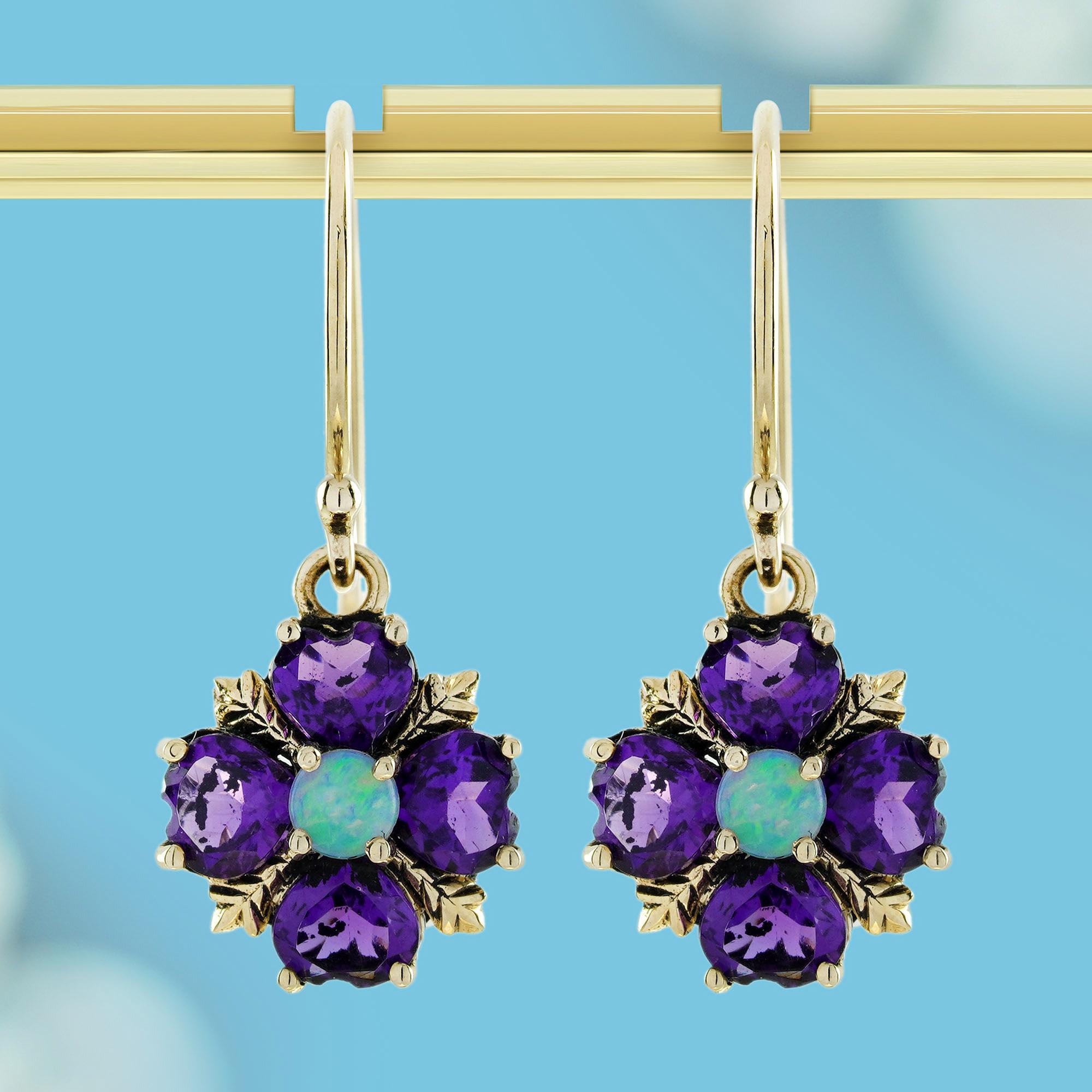 A captivating fusion of vibrant colors and vintage charm. At the heart of each earring, the mesmerizing opals shimmer with an iridescent play of colors, reflecting the beauty of nature’s finest gems. Surrounding the opals, rich purple amethysts add