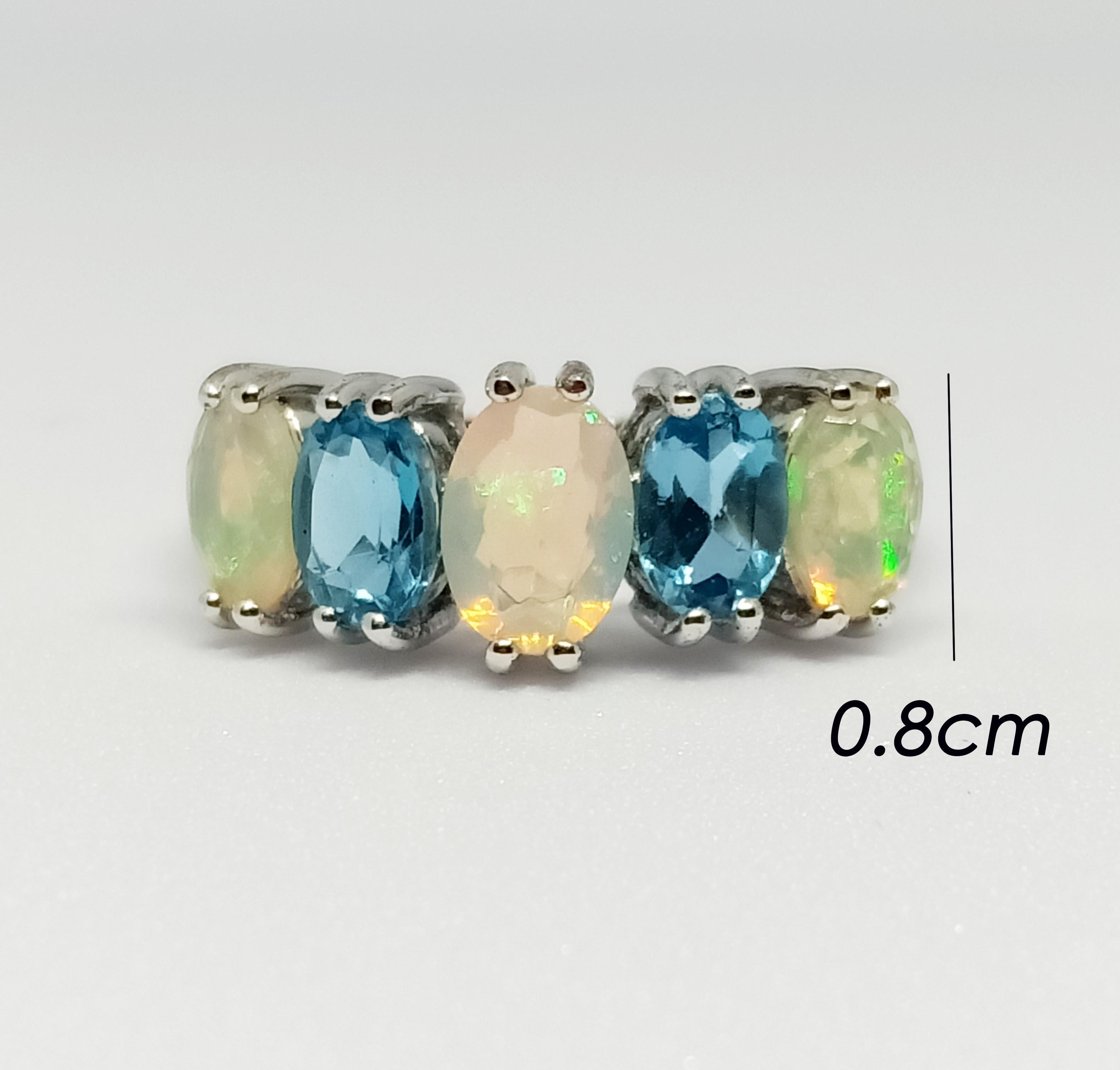 Opal oval 7x5 mm. 1 pcs.
Opal oval 6x4 mm. 2 pcs.
blue topaz 6x4 mm. 2 pcs.
18K white gold Plated over sterling silver
