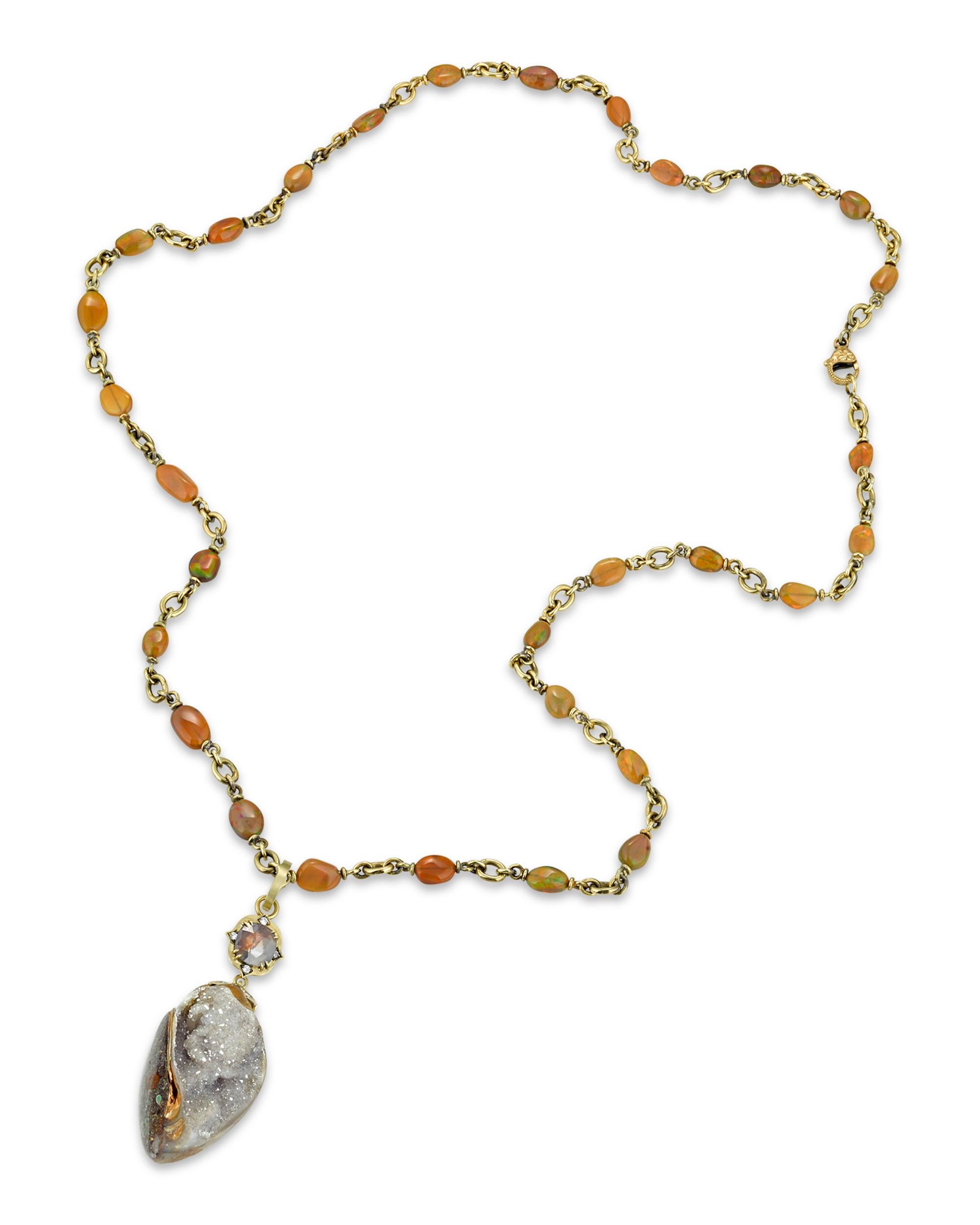 This one-of-a-kind necklace was crafted by the Los Angeles-based jewelry designer Sylva & Cie. The timeless design displays an organic beauty thanks to the dazzling crystalized fossil shell that forms the pendant. The hand-crafted chain is formed