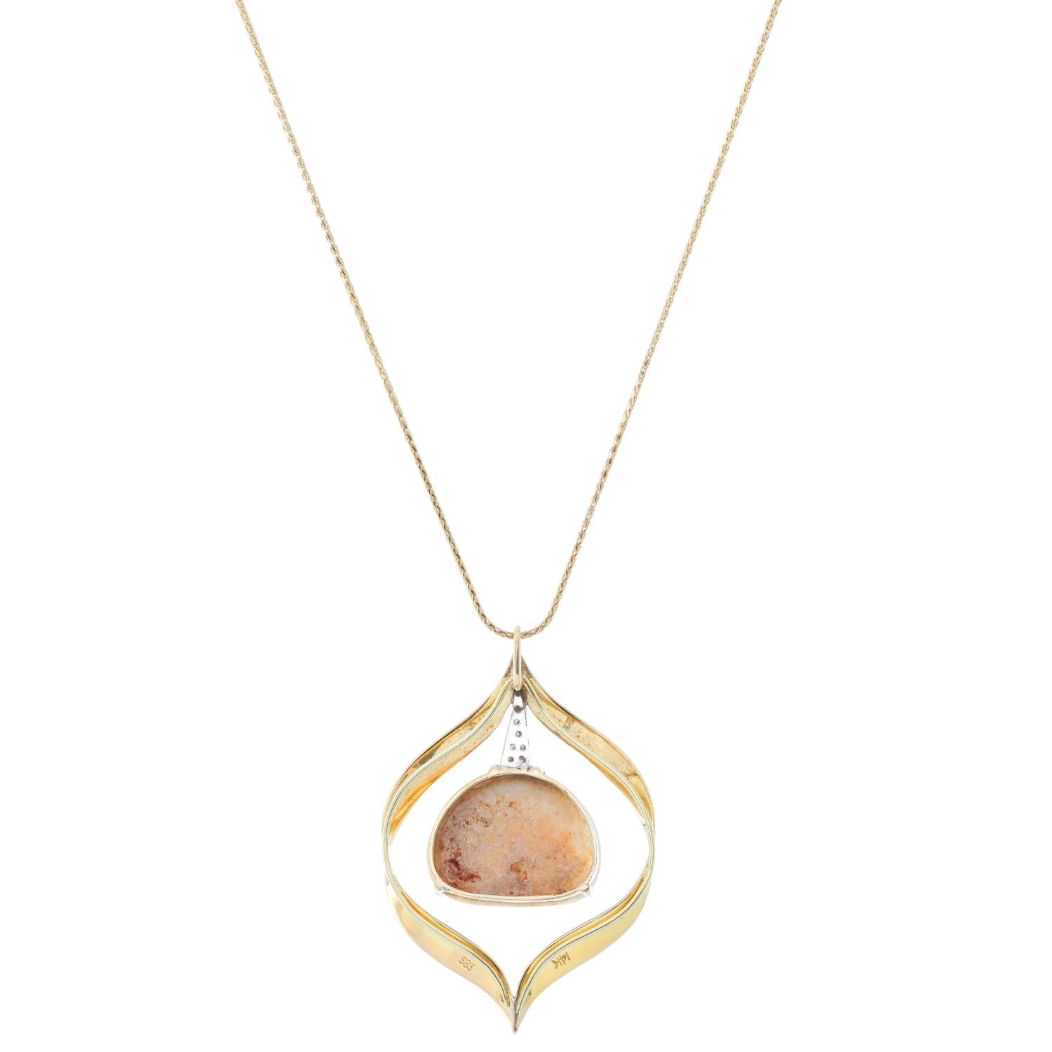 Opal and Diamond 14K Yellow Gold Necklace & Pendant - Beautiful round brilliant cut diamonds on a leaf pendant. Diamond approx. .06 cts. with a floating white opal. Opal approx. 8 cts. Total weight 3.03 grams.Total length 11 3/4 inches.