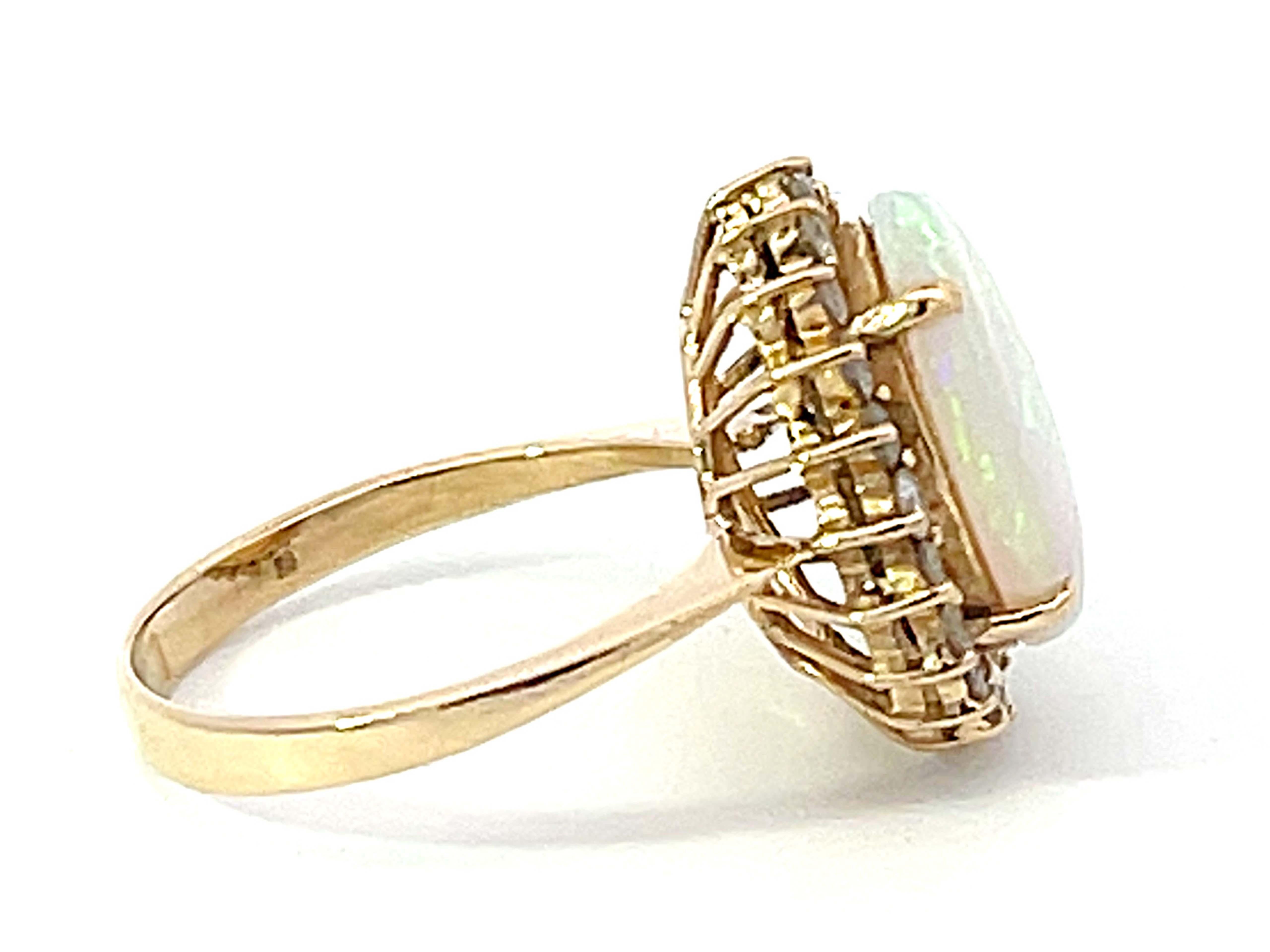 Opal and Diamond Halo Ring in 14k Yellow Gold In Excellent Condition For Sale In Honolulu, HI