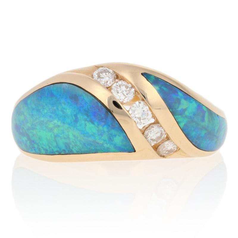 Make this gorgeous ring your signature piece! Fashioned by Kabana in 14k yellow gold, this NEW piece features a modified bypass-style band adorned in the center with a swirl of five channel-set diamonds. Inlaid opals with fabulous blue-green