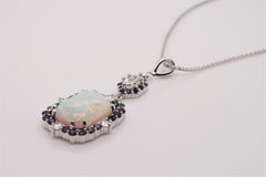 Opal and Diamond Pendant with Sapphire and Diamond Halos Set in 18 Karat Gold