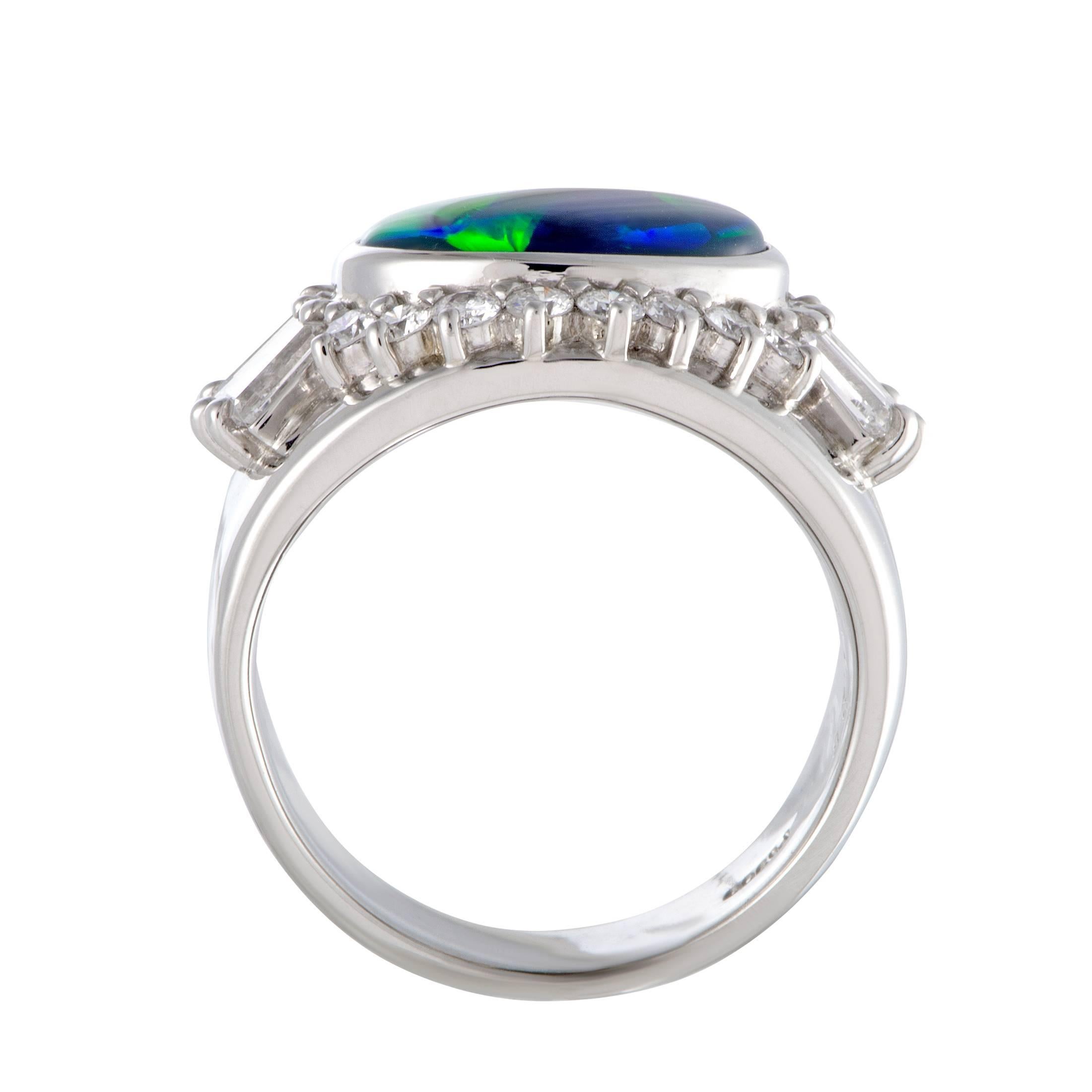 This breathtaking ring is beautifully designed in shimmering platinum. The sensational ring displays an exquisitely charming appeal with its extravagant adornment of dazzling diamonds, weighing 1.25ct, and a stunning opal, weighing 2.88ct.
Ring Top