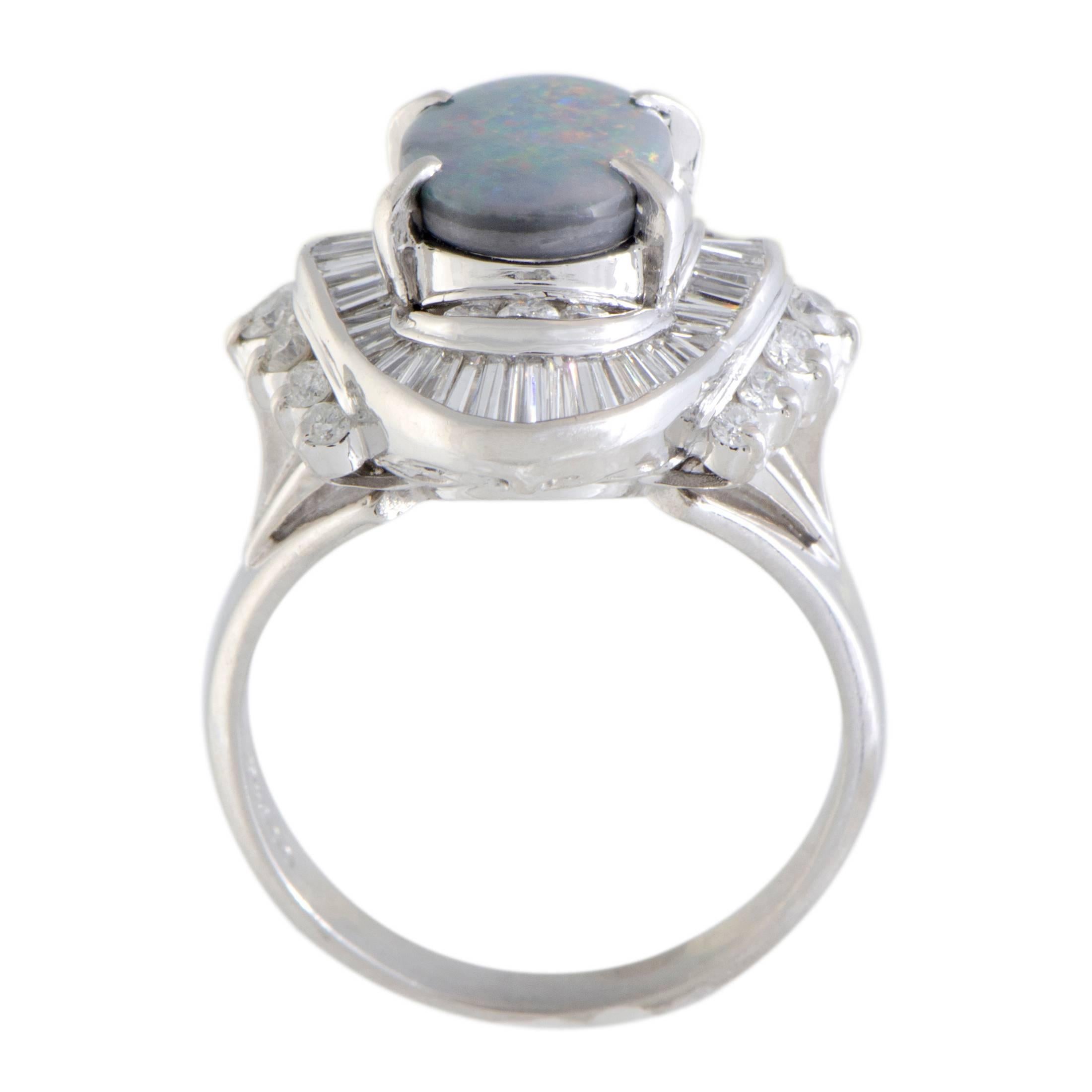 The prestigious sheen of platinum combined with the luxurious resplendence of diamonds presents the perfect backdrop for the colorful opal in this stunning ring. The diamond stones amount to 1.08 carats, while the opal weighs 1.78 carats.
Ring Top