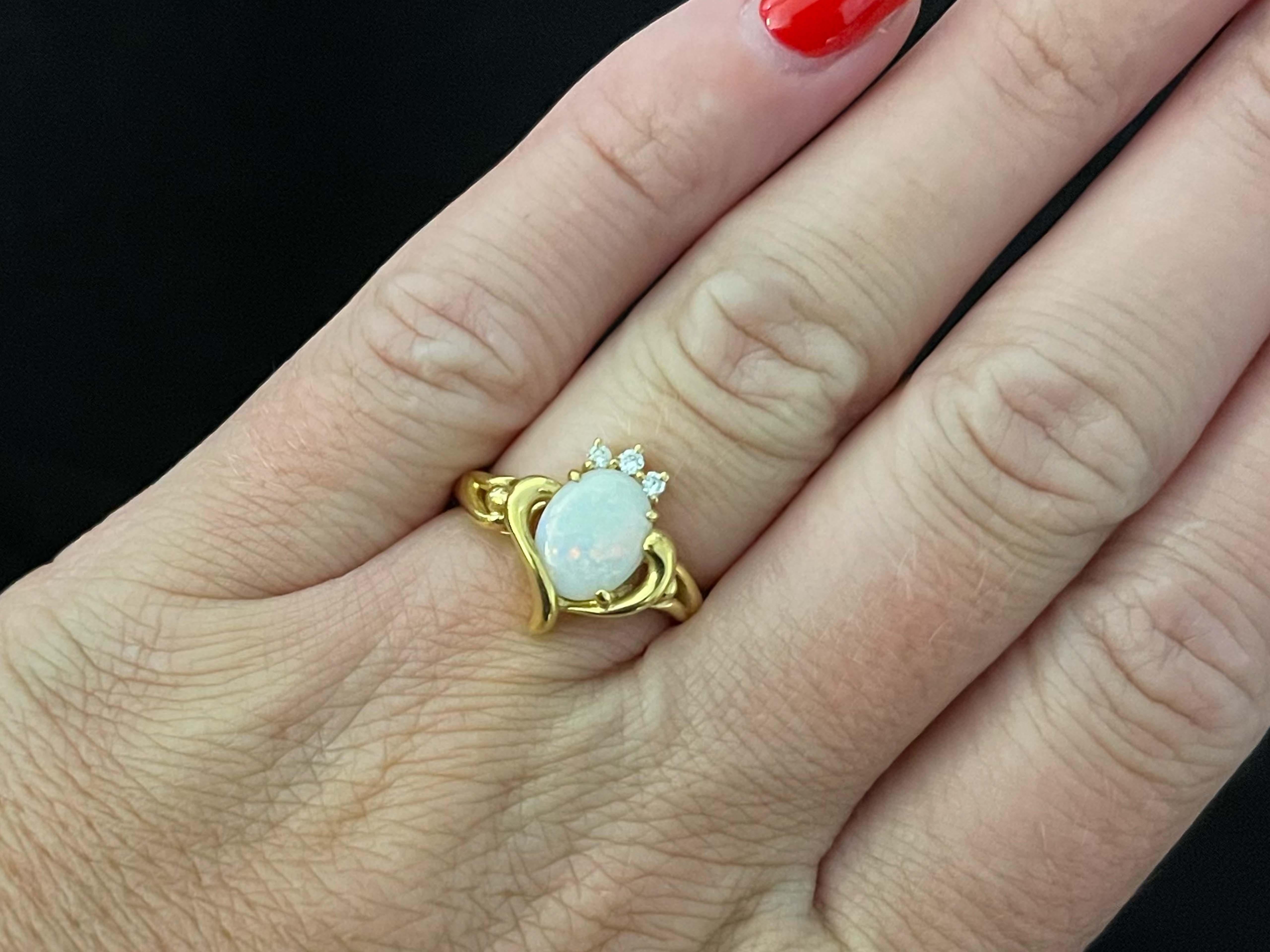 Item Specifications:

Metal: 18K Yellow Gold 

Style: Opal and Diamond Ring

Total Weight: 4.4 Grams

Ring Size: 6 (resizable)

Gemstone Specifications:

Center Gemstone: Opal

Gemstone Measurements: 9.2 mm x 7.3 mm x 2.3 mm

Gemstone Carat Weight: