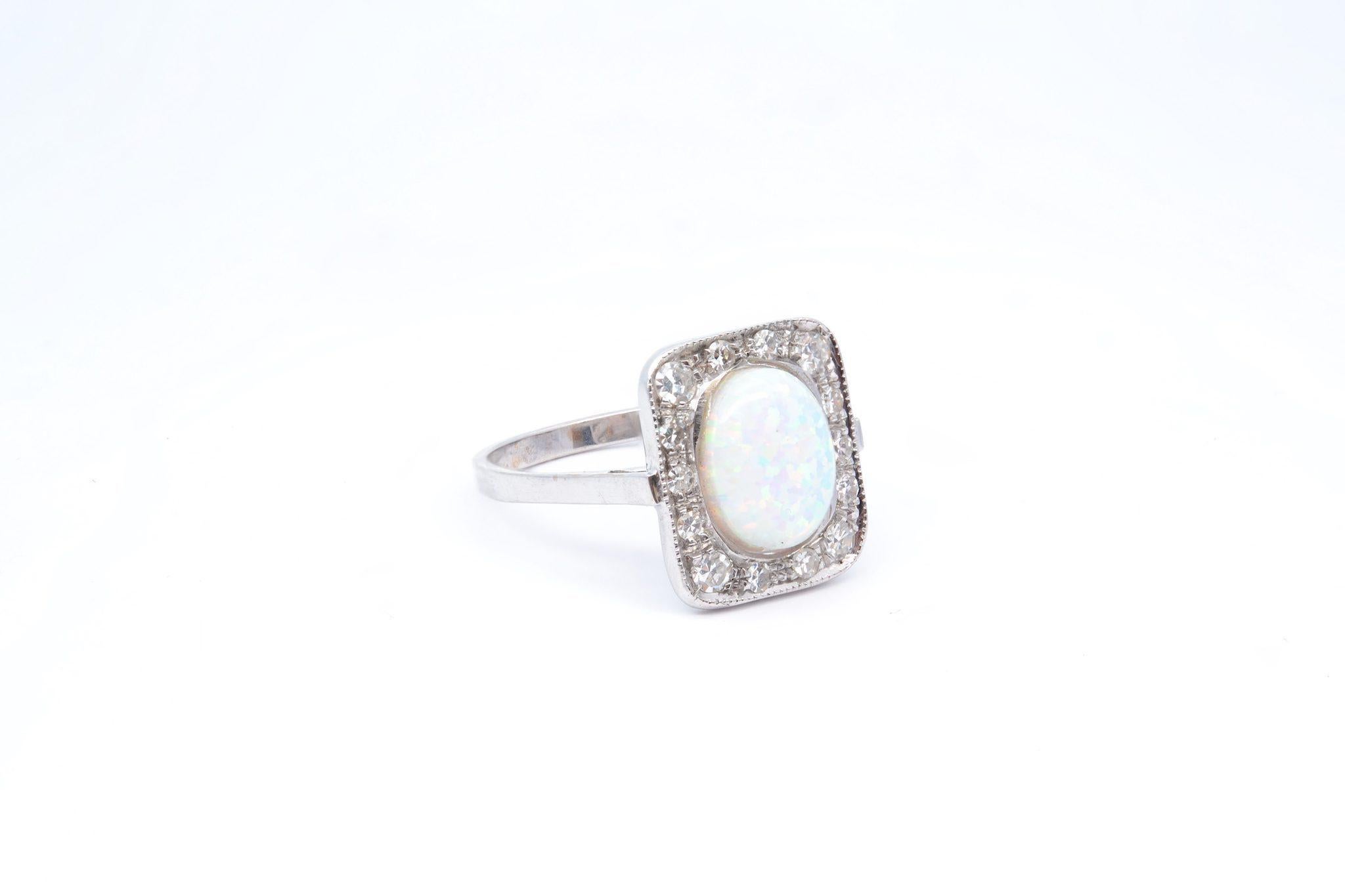 Cabochon Opal and diamonds ring in 18k gold For Sale