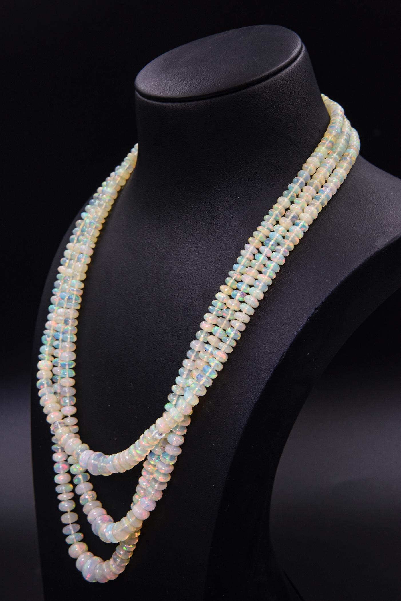 This gorgeous opal necklace features 3 strands of Ethiopian crystal opal beads.  The largest opal is 9.9 mm and the smallest is 4.8 mm.  The total carat weight in opals is 249 carats of vibrant stones.  They are beautiful stones with lots of flashes