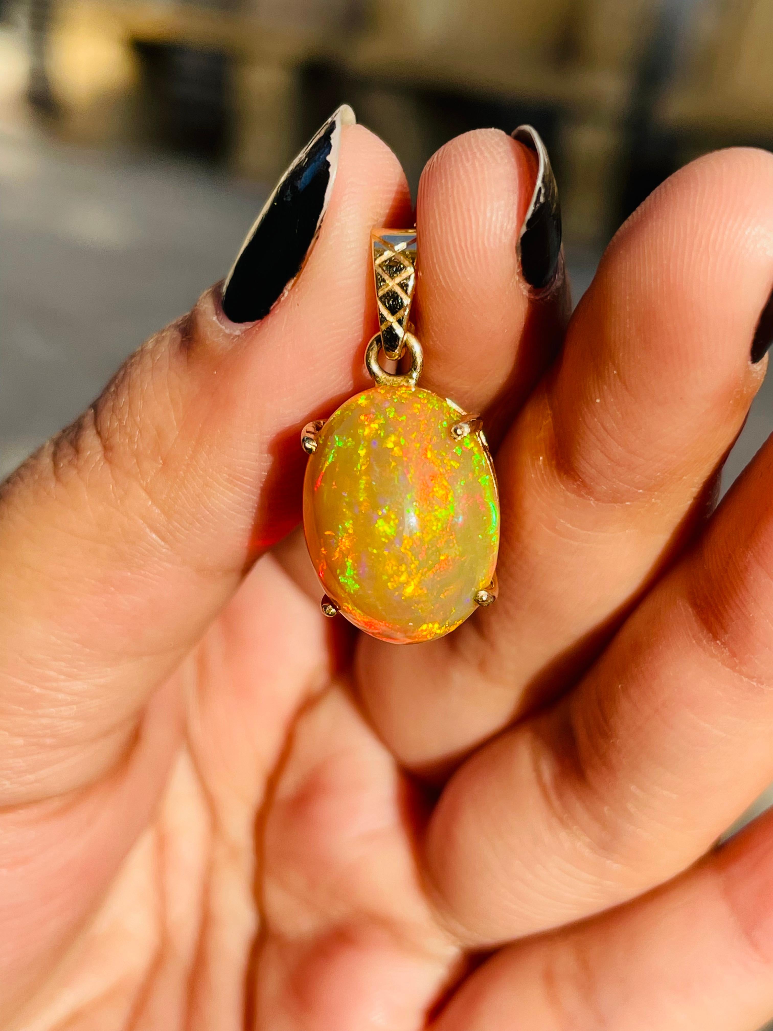Opal pendant in 18K Gold. It has a oval cut gemstone that completes your look with a decent touch. Pendants are used to wear or gifted to represent love and promises. It's an attractive jewelry piece that goes with every basic outfit and wedding