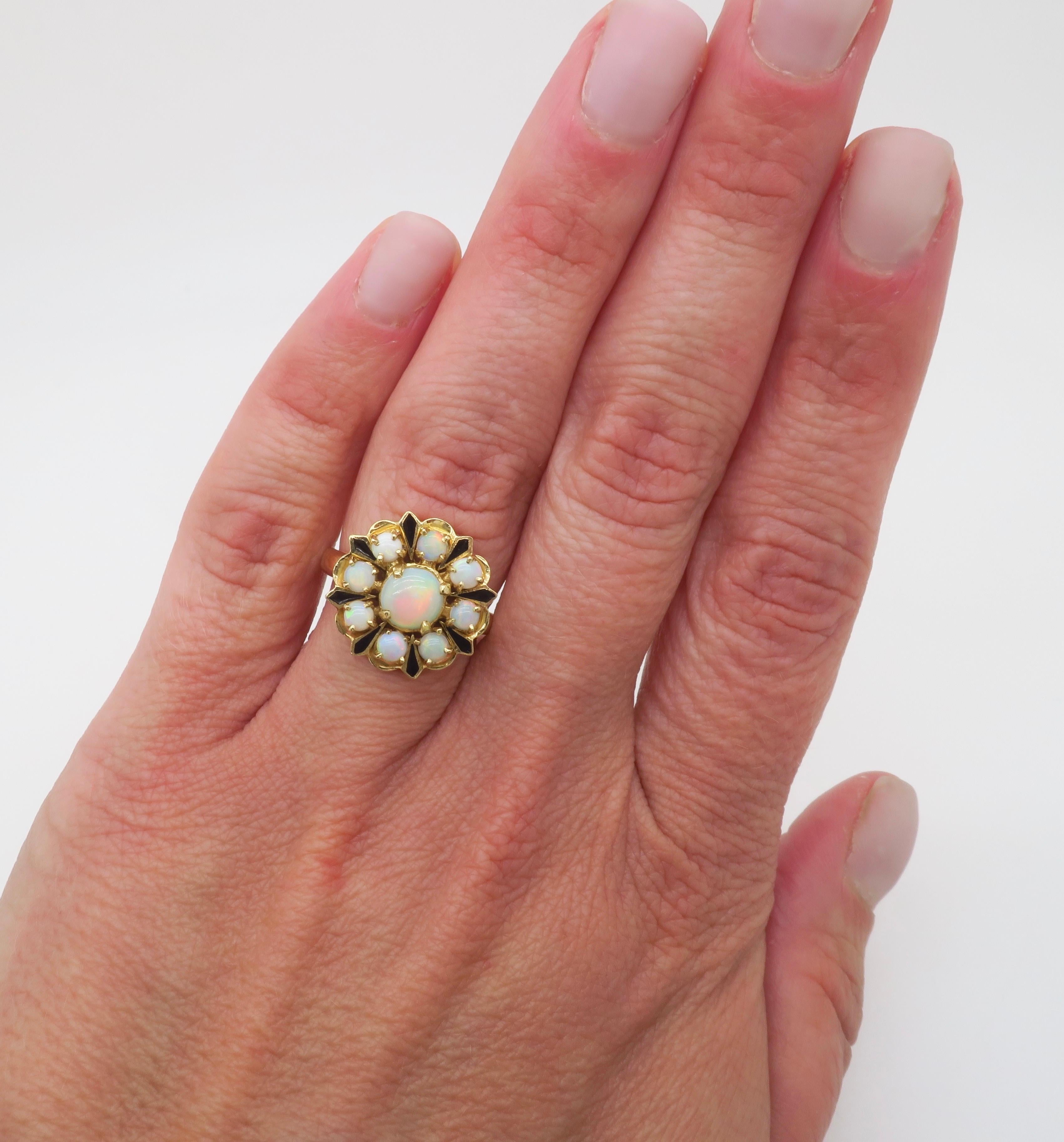 Opal & Black enamel ring made in 14k yellow gold. 

Gemstone: Opal
Metal: 14K Yellow Gold
Stamped: 