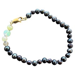 Bracelet de perles noires opales naturelles J Dauphin
