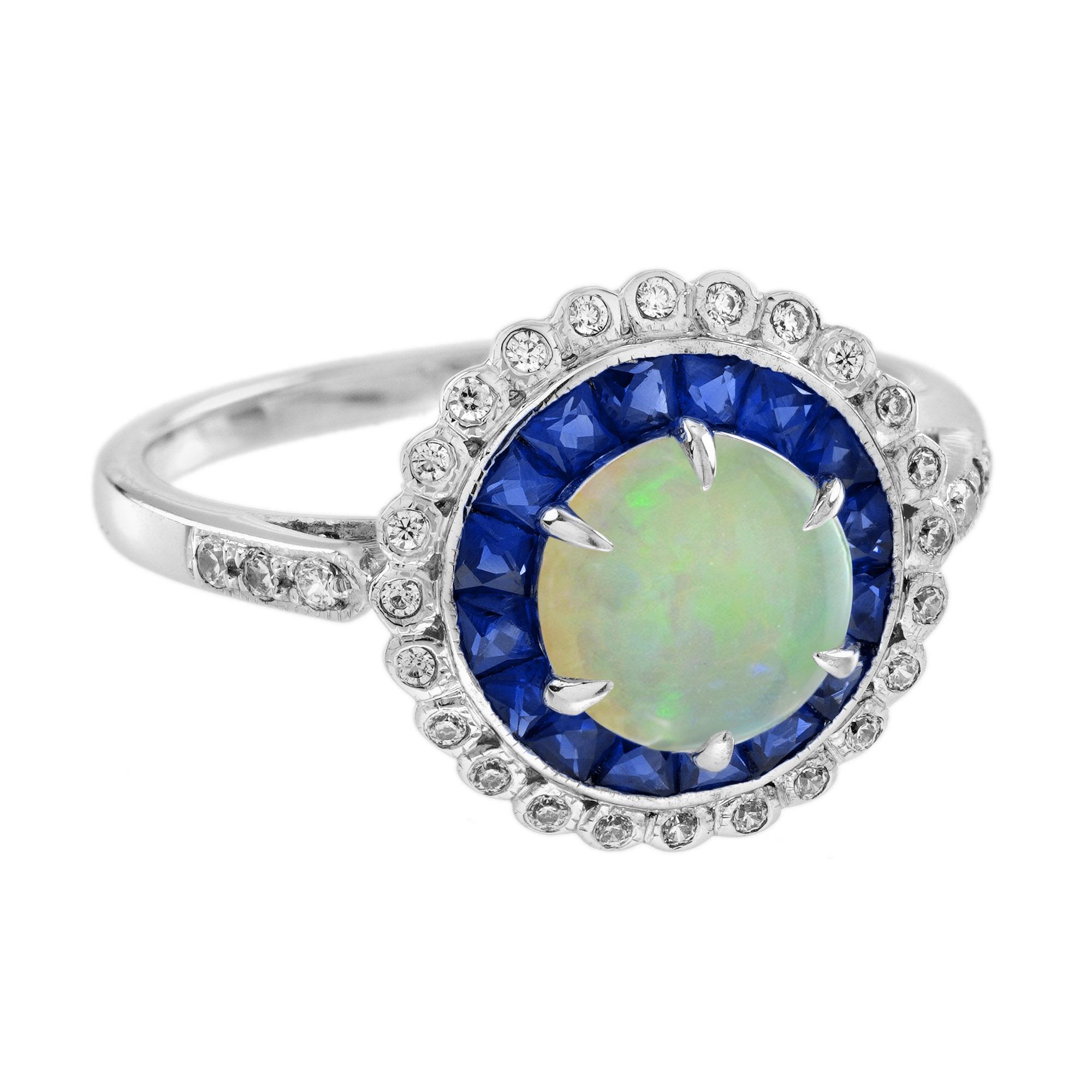 Cette exquise bague de fiançailles de style Art déco met en valeur une opale lumineuse, symbole intemporel d'amour, d'espoir et de souhaits sincères. Connue pour son jeu de couleurs captivant, l'opale est censée soutenir le pouvoir de la réussite