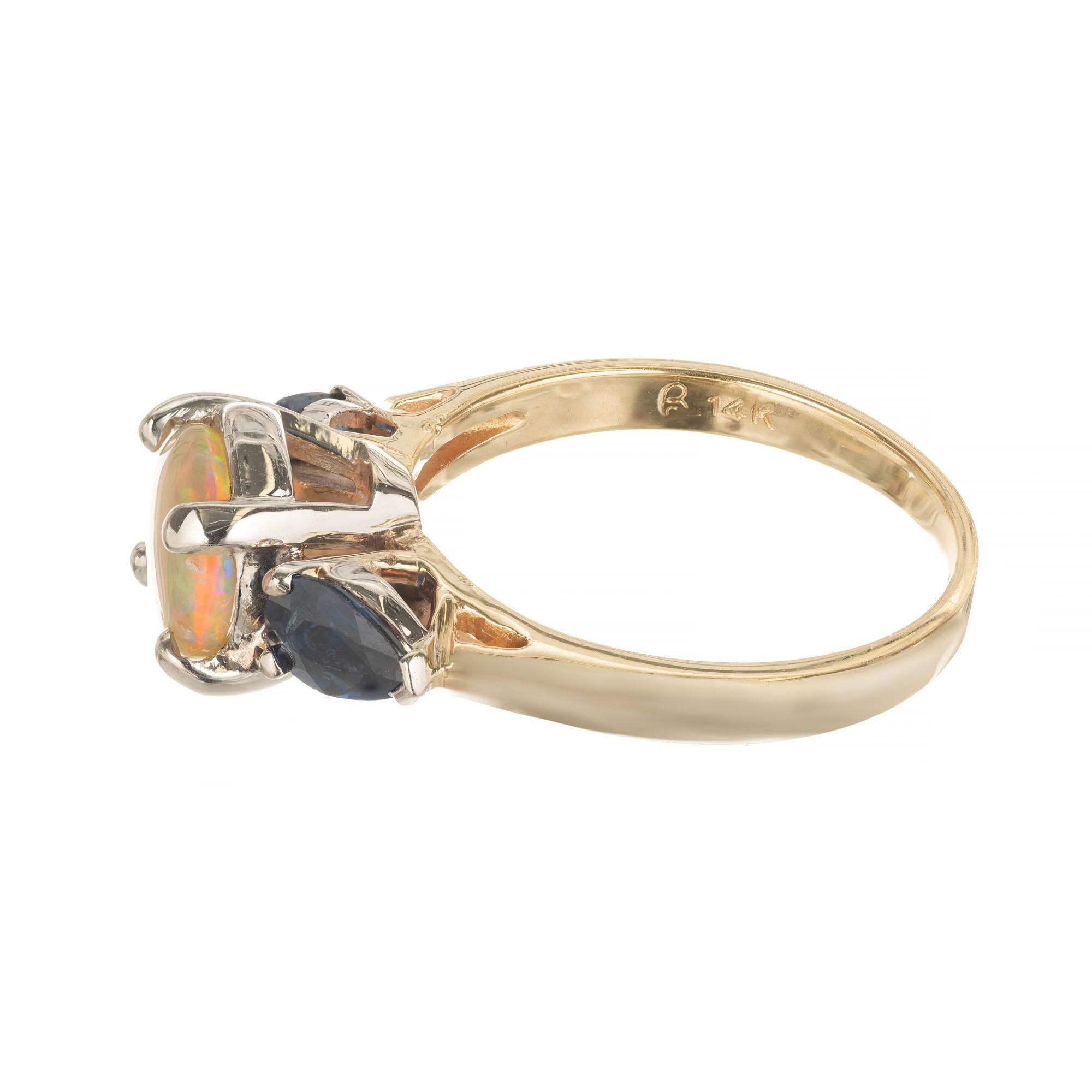 Round Cut Opal Blue Sapphire Two-Tone Gold Three-Stone Engagement Ring