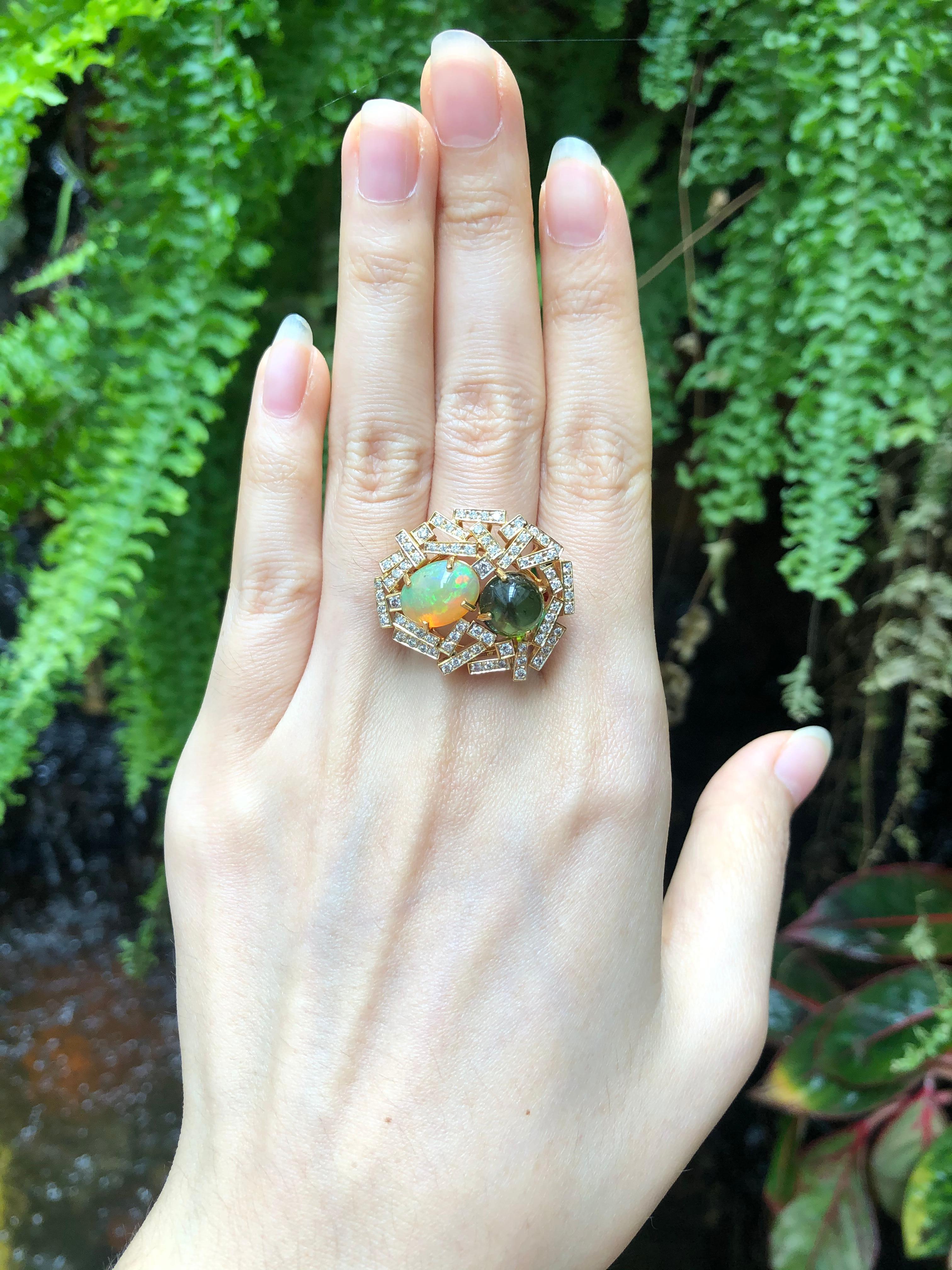 Opal 2.06 carats, Cabochon Green Tourmaline 3.52 carats with Brown Diamond 0.79 carat Ring set in 18 Karat Gold Settings

Width:  3.0 cm 
Length: 2.5cm
Ring Size: 56
Total Weight: 15.72 grams

