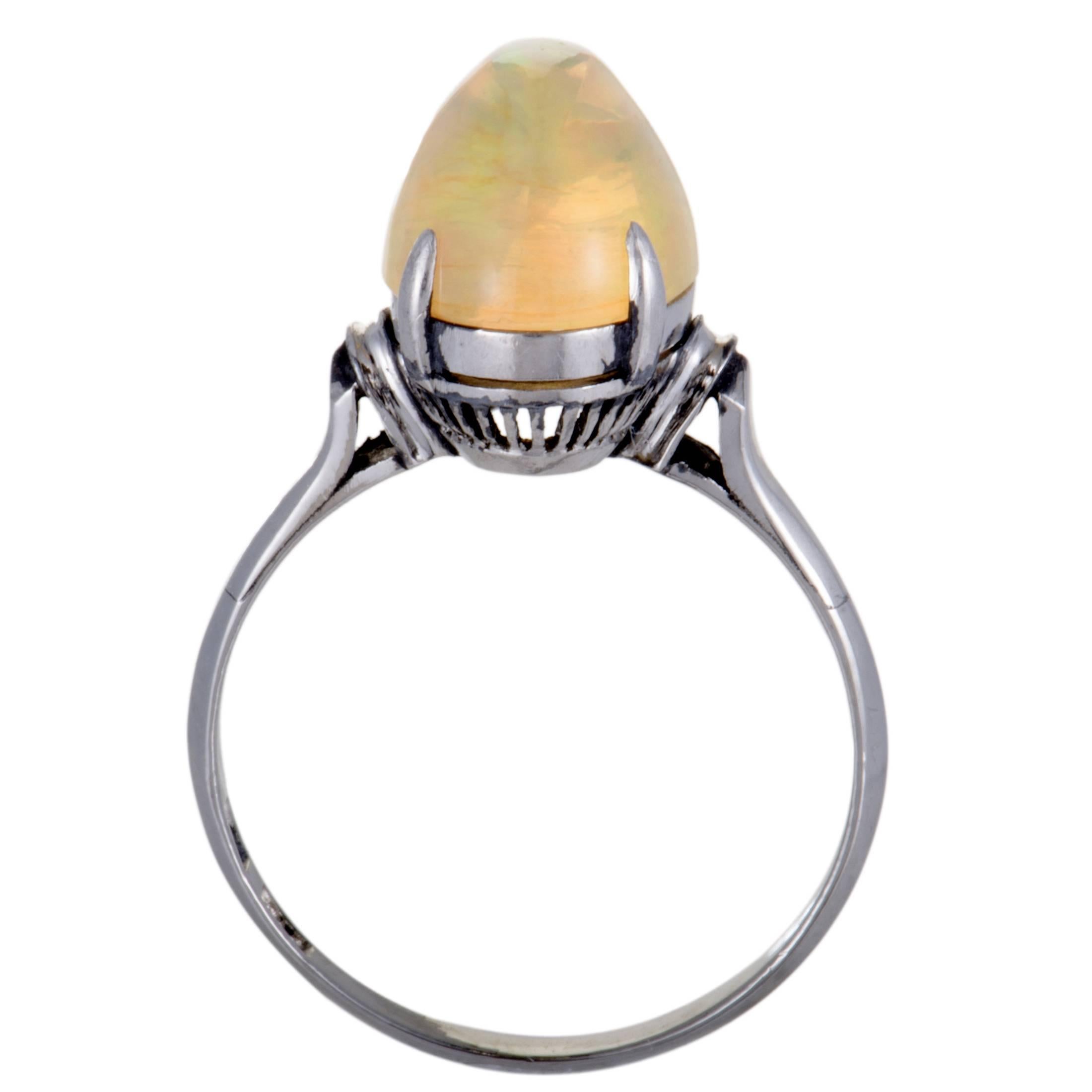 The fashionably unique design of this splendid ring boasts a nifty feel of prestigious elegance. The spectacular ring is made of shimmering platinum and is adorned in a captivating yellow fire opal that elevates the beauty of the fabulous