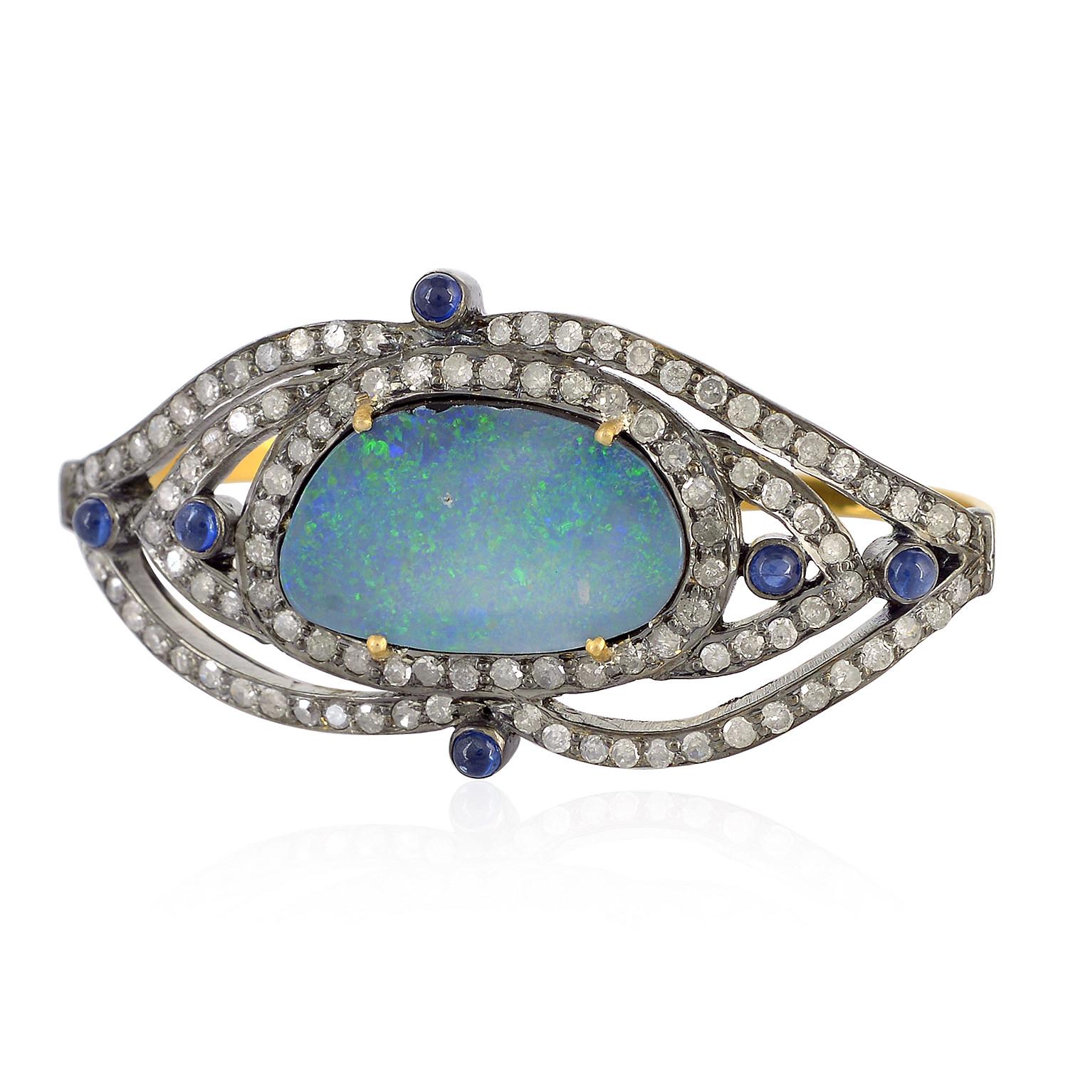 18kt:2.32gms,D:1.22cts,Slv:4.85gms,
Blue Sapphire:0.35cts,Opal:5.70cts
