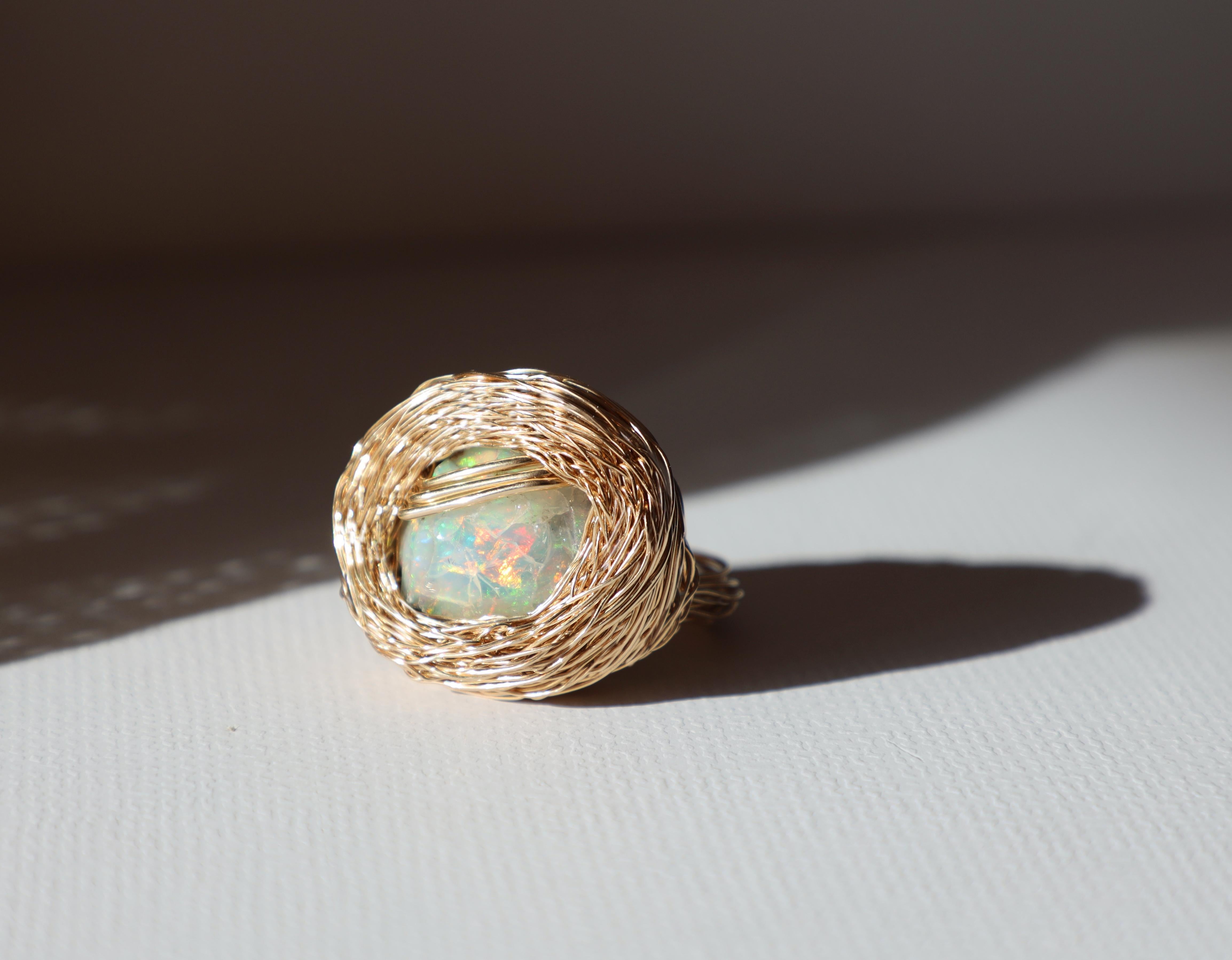 Introducing ring Astrude – a captivating and unique cocktail jewel. This masterpiece epitomises the essence of raw elegance, as she is created around a chunk of raw opal, which is also Sheila Westera's unique signature; starting with a stone as a