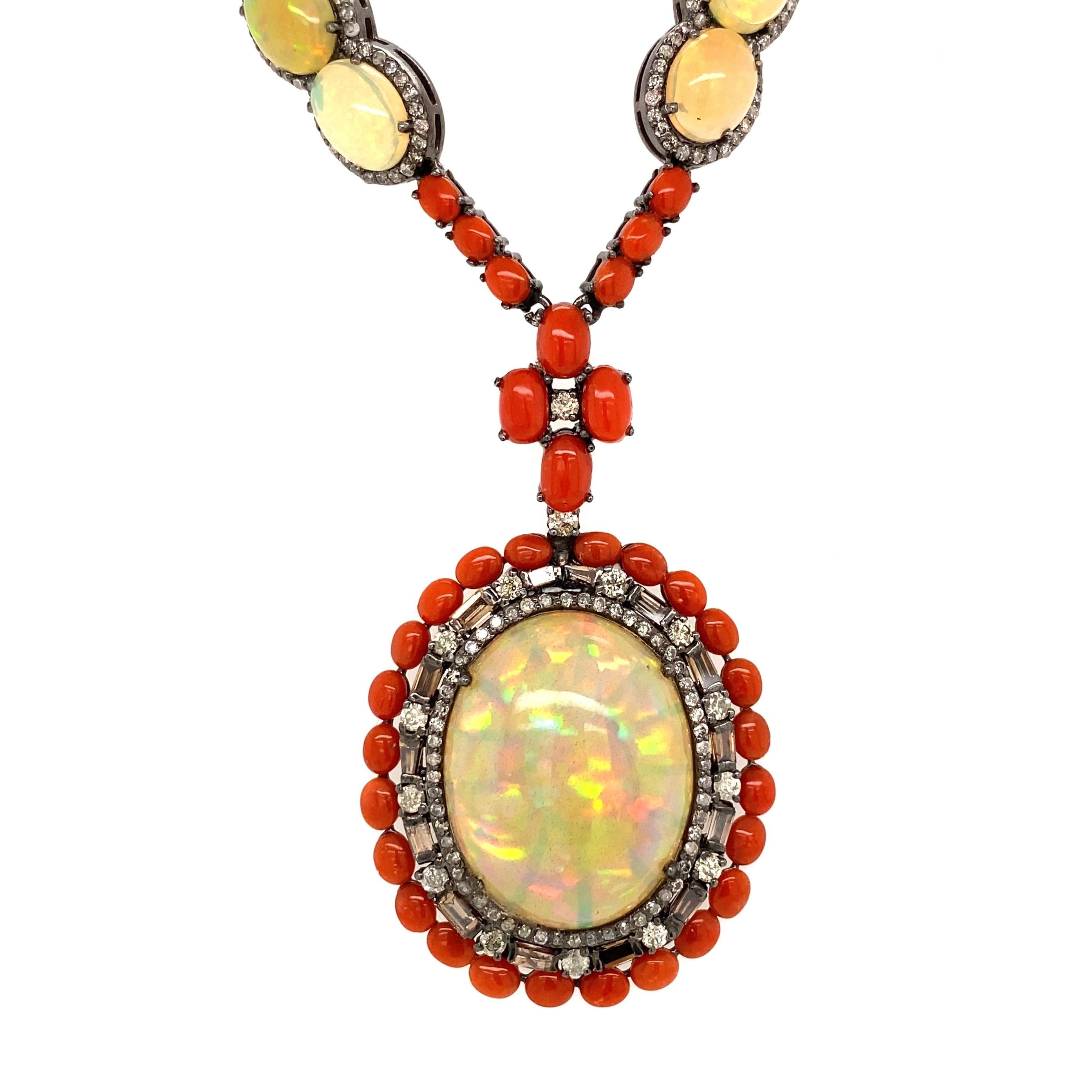 Beautiful finely detailed Necklace featuring 20 oval Opal Gemstones 44.13tcw, surrounded by Diamonds approx. 3.30tcw, interspaced with Coral, approx. 17tcw. Hand crafted Custom Made in 14 Karat Gold and Sterling Silver 925 mounting. Approx.
