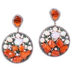 Pendants d'oreilles en opale, émeraudes et diamants 70 carats