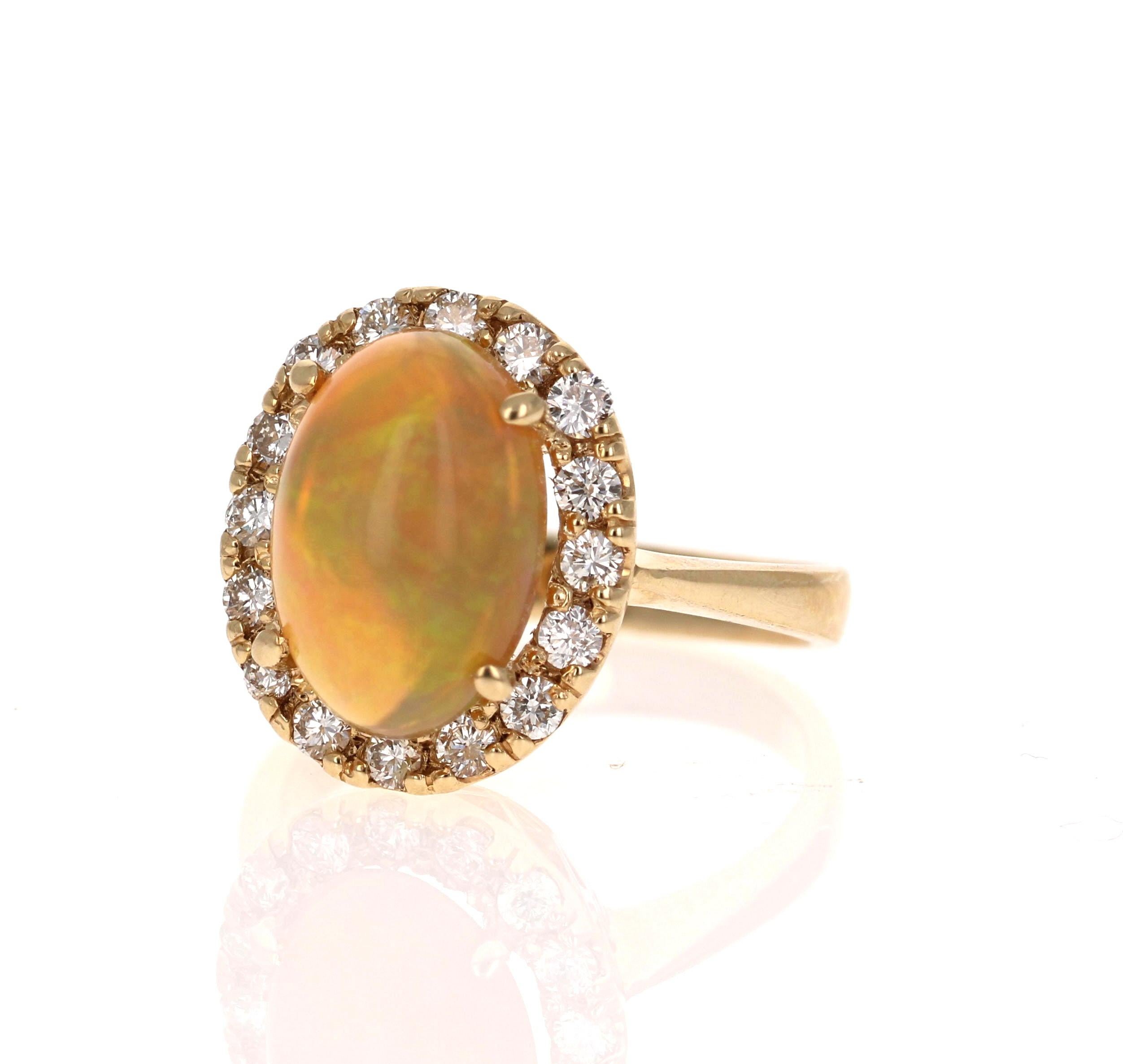 This ring has a cute and simple 2.88 Carat Opal and has a Halo of 16 Round Cut Diamonds that weigh 0.55 Carats (Clarity: VS2, Color: H). The total carat weight of the ring is 3.43 Carats. 

The Opal displays beautiful flashes of green, yellow, and