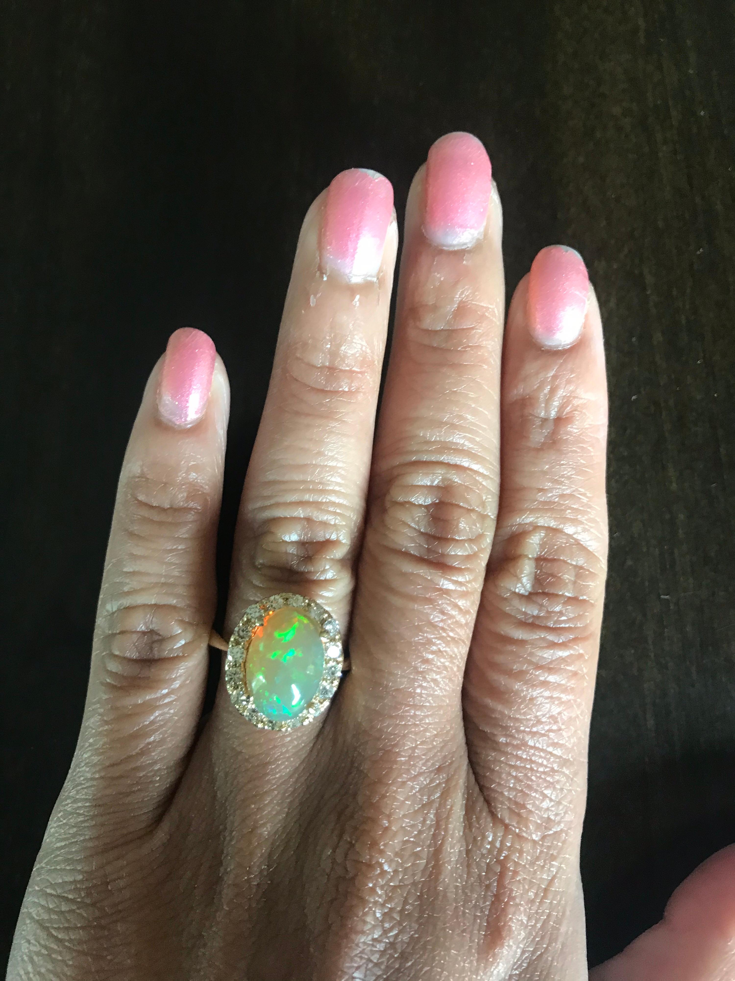 Oval Cut Opal Diamond 14 Karat Yellow Gold Halo Ring For Sale